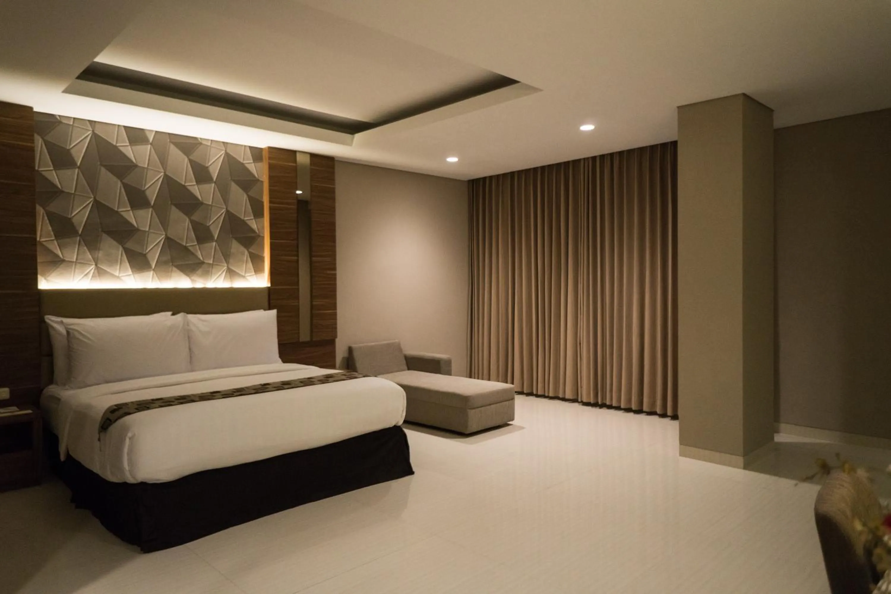 Photo of the whole room, Bed in Novena Hotel Bandung