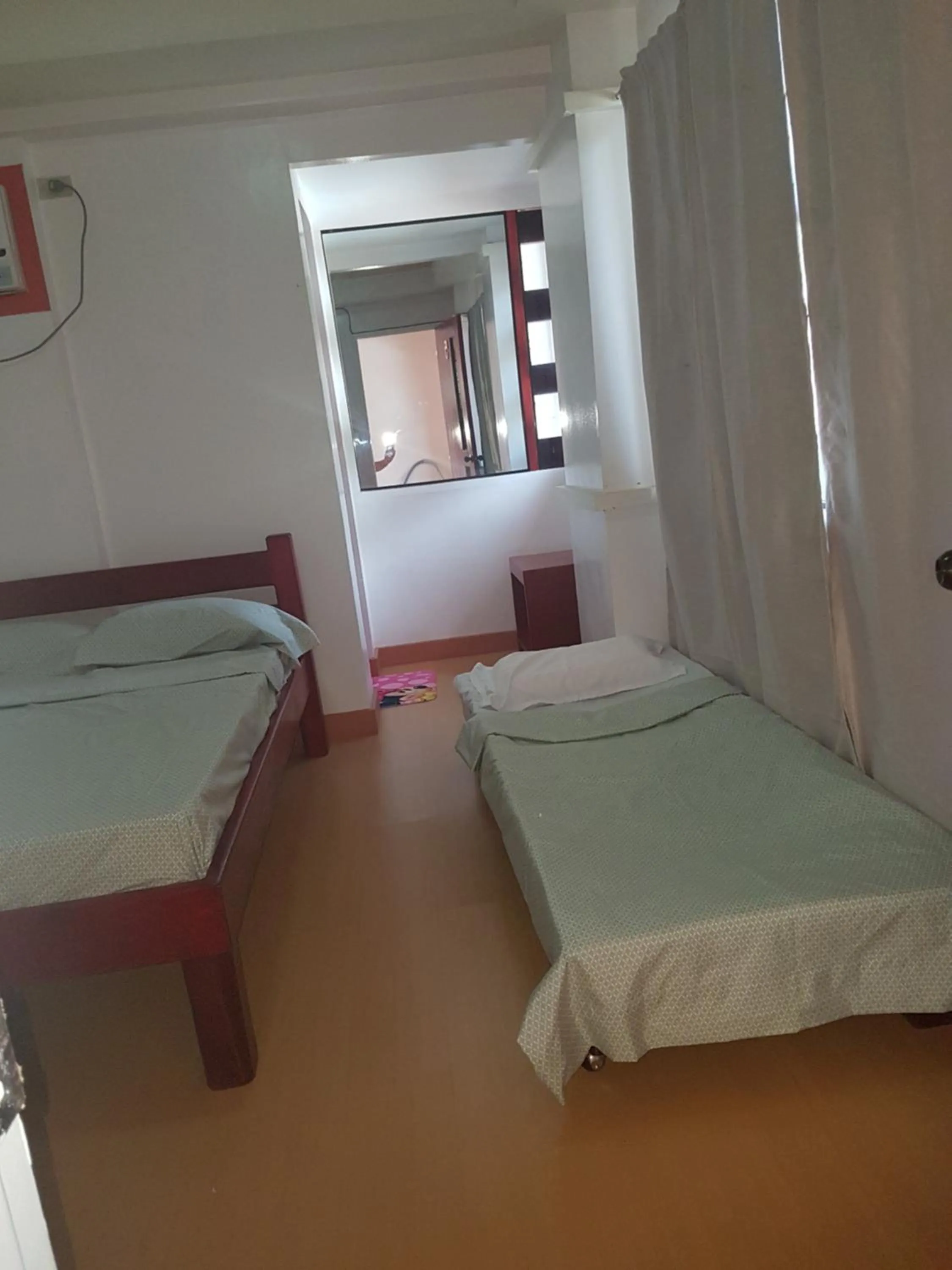 Bed in Catalina`s Inn family room