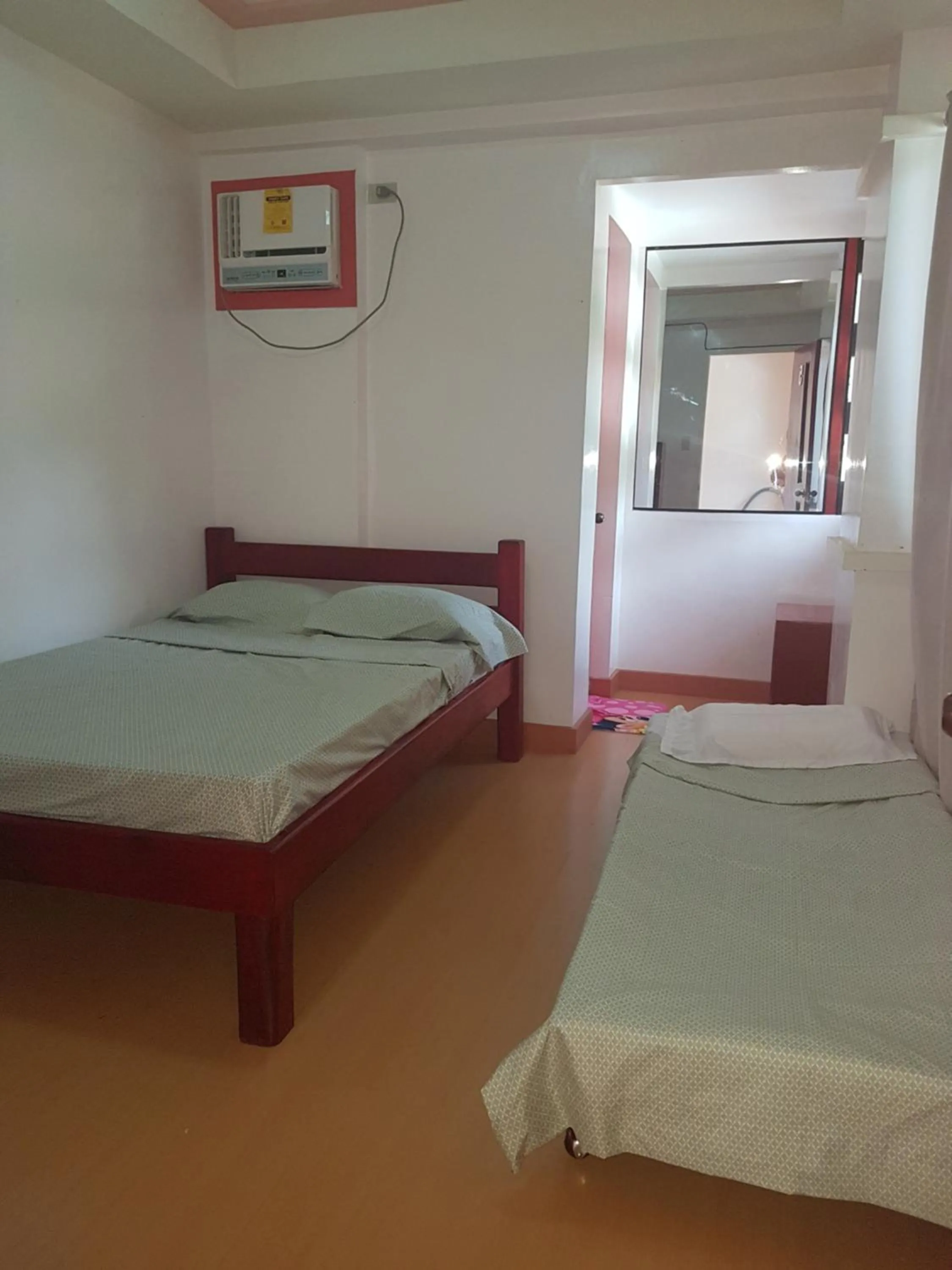 Bed in Catalina`s Inn family room