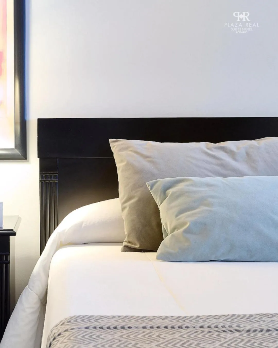 Bed in Plaza Real Suites Hotel