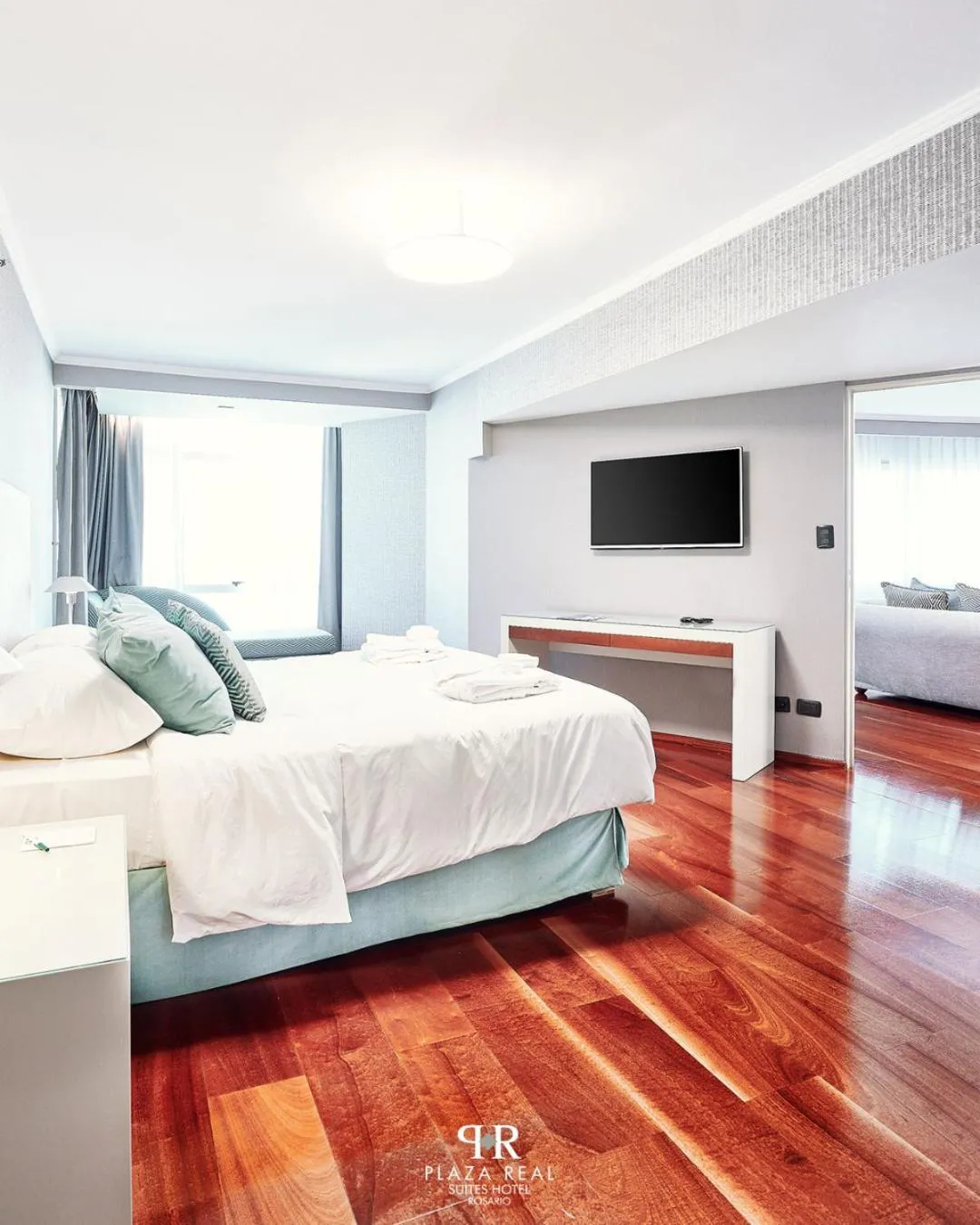 Bed in Plaza Real Suites Hotel