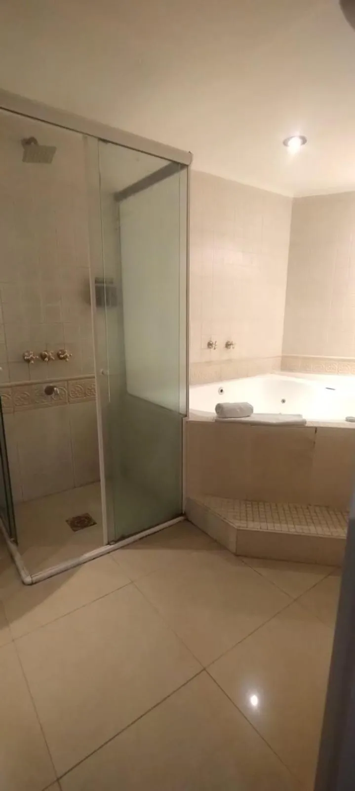 Shower in Plaza Real Suites Hotel