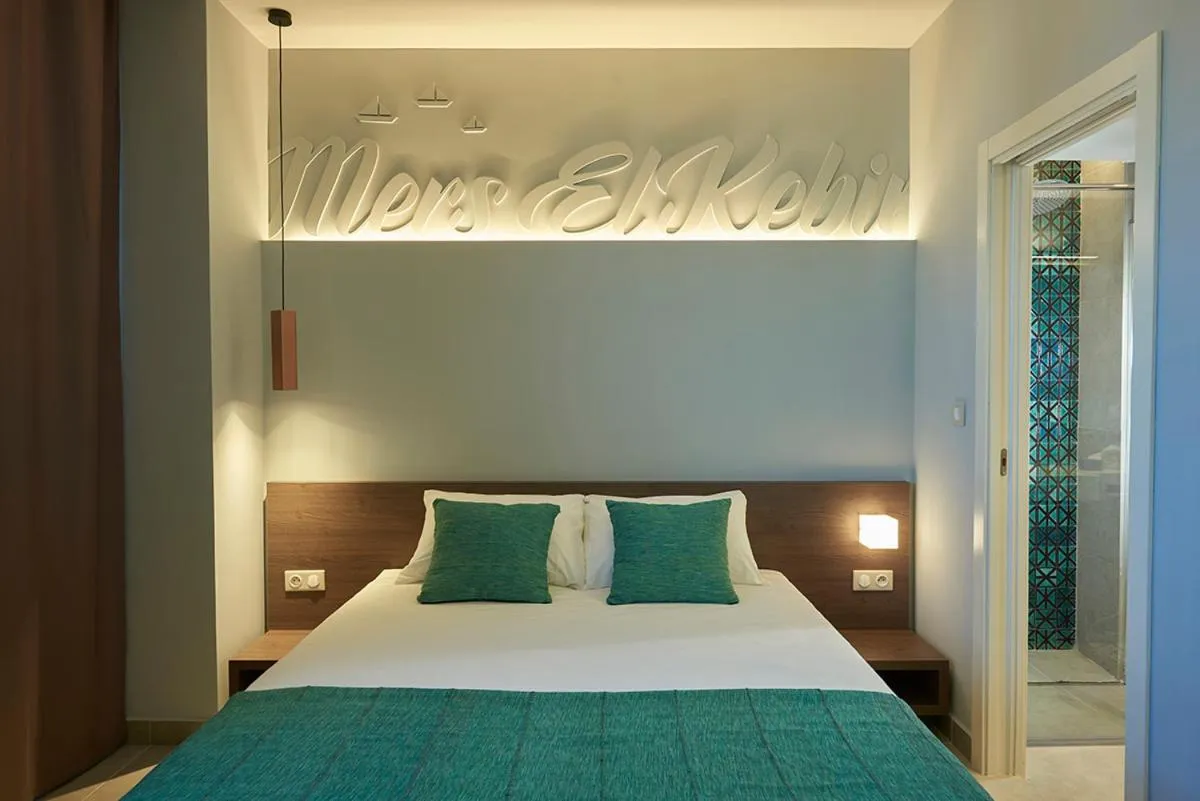 Bed in M Suite Hotel