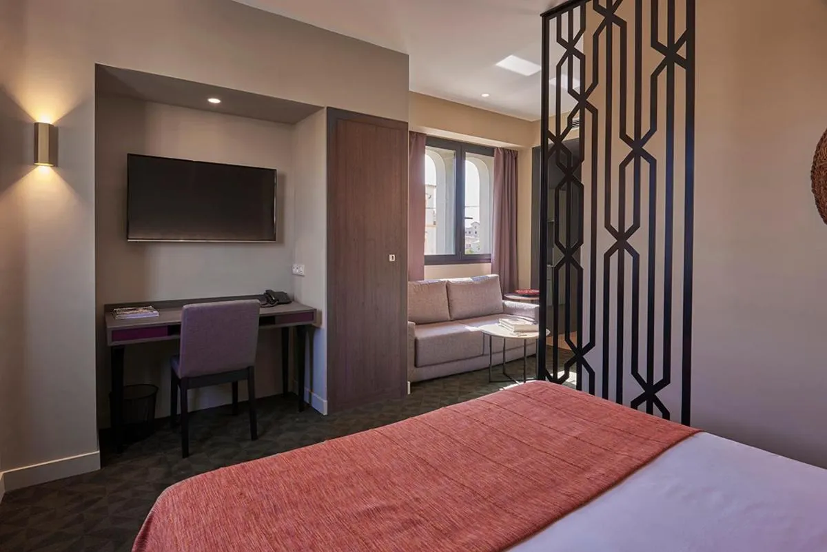 Bed in M Suite Hotel