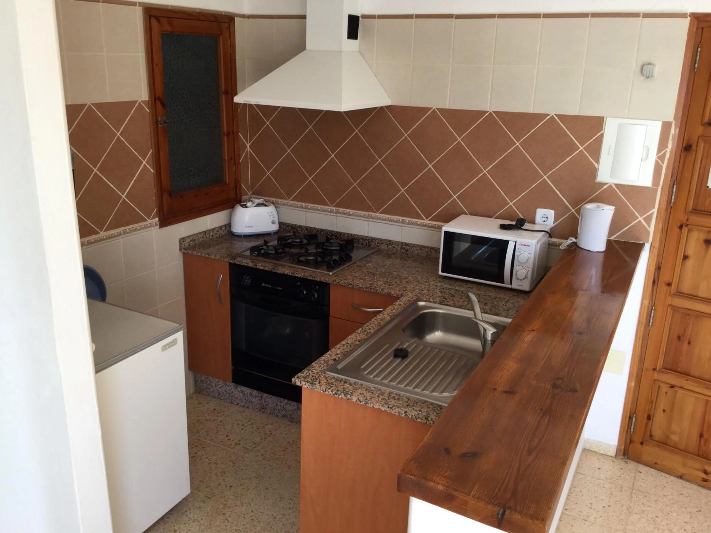 Kitchen or kitchenette in Apartamentos Alba