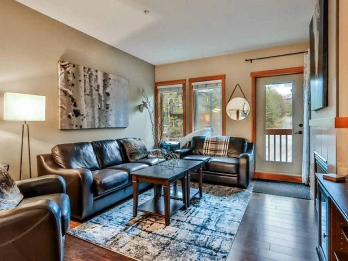 Living room in Suites with Pool & Hot tubs managed by Little Sister Getaways