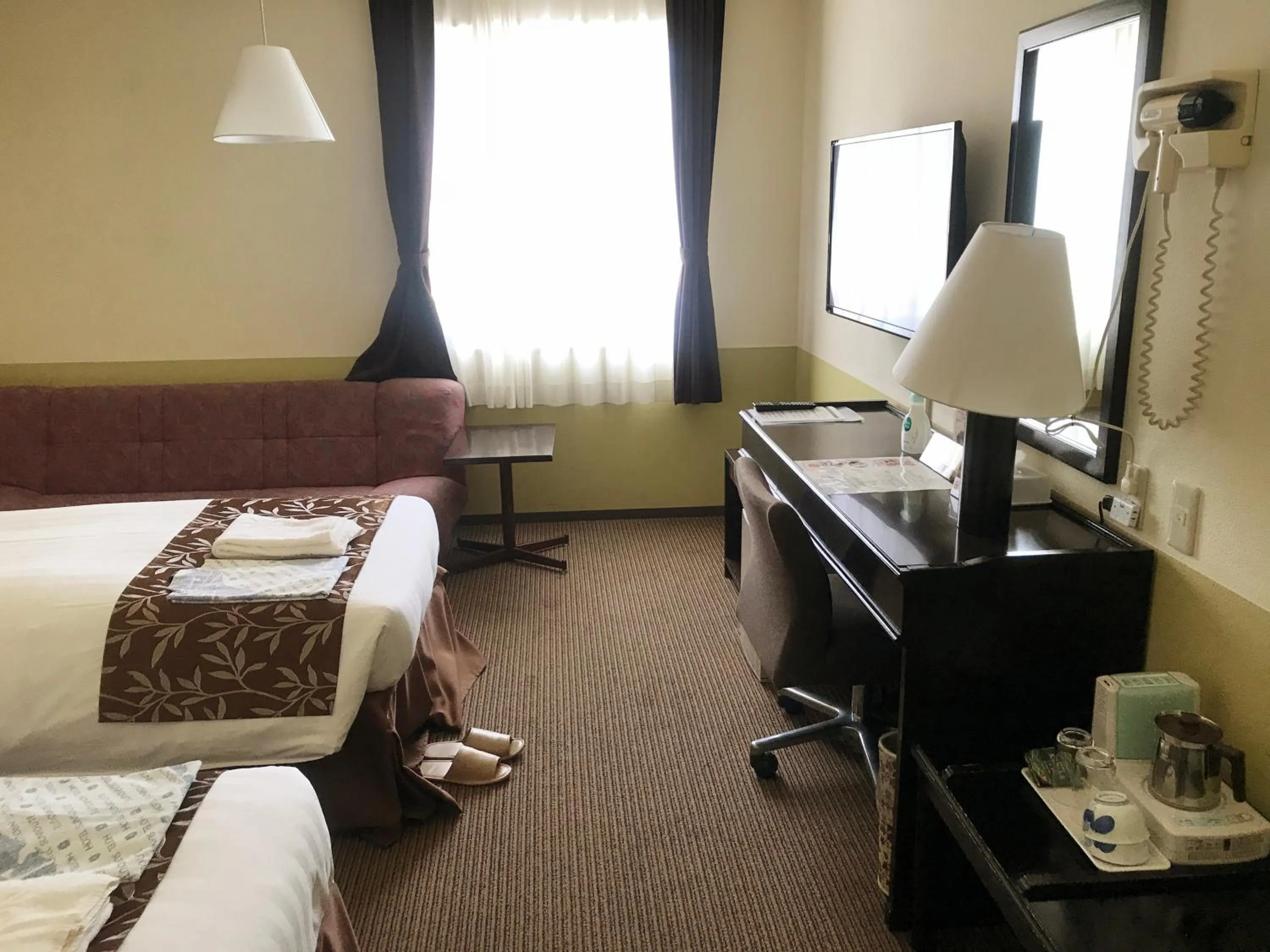 Living room, Bed in Hotel Crown Hills Kamaishi