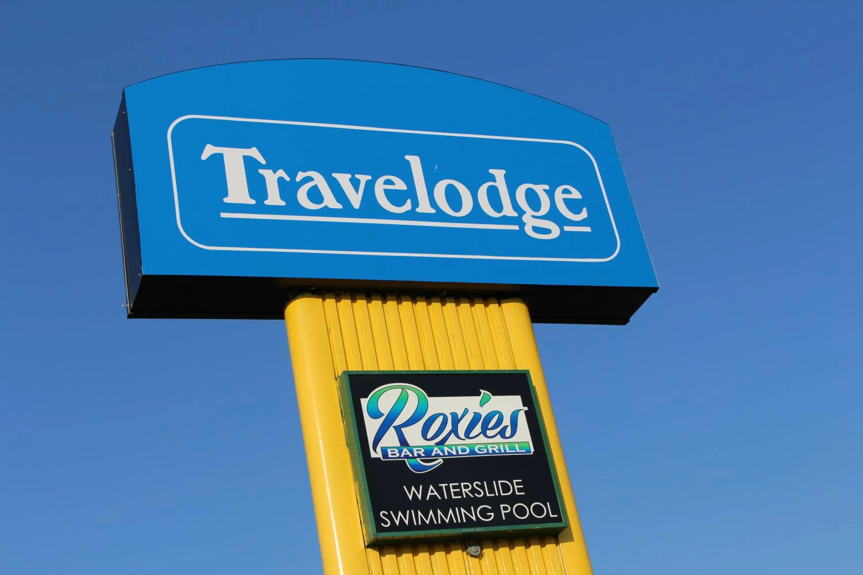 Property logo or sign in Travelodge by Wyndham Swift Current