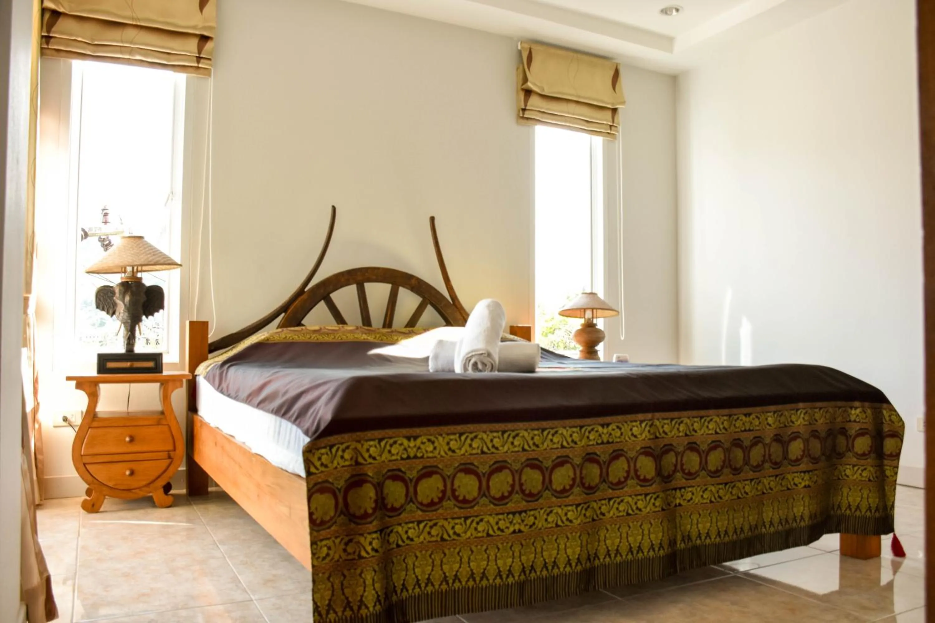 Bed in Baan Rosa Bangtao Beach