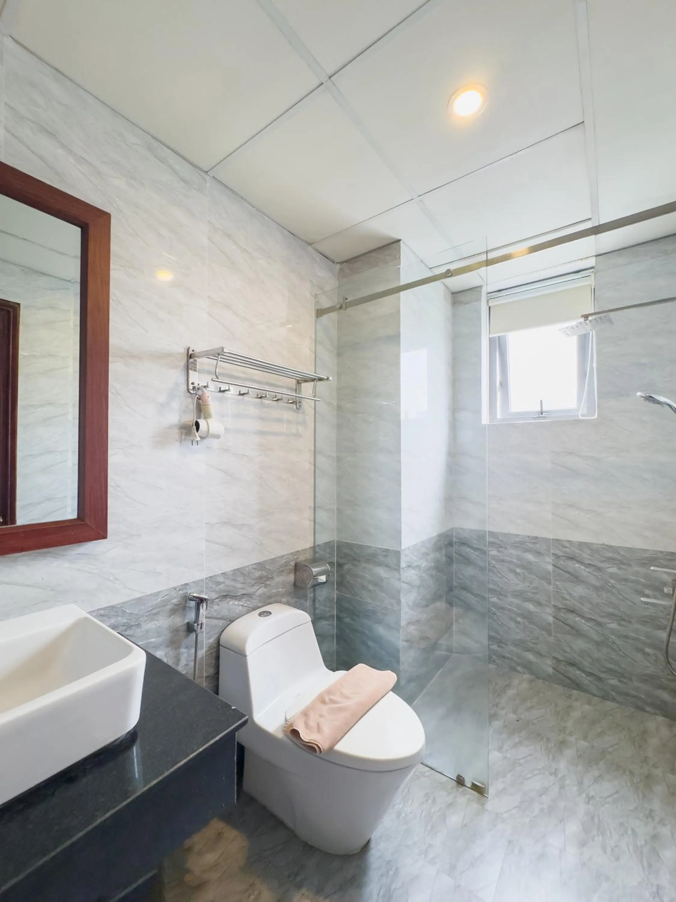 Toilet in Quoc Cuong Center Da Nang Hotel by Haviland