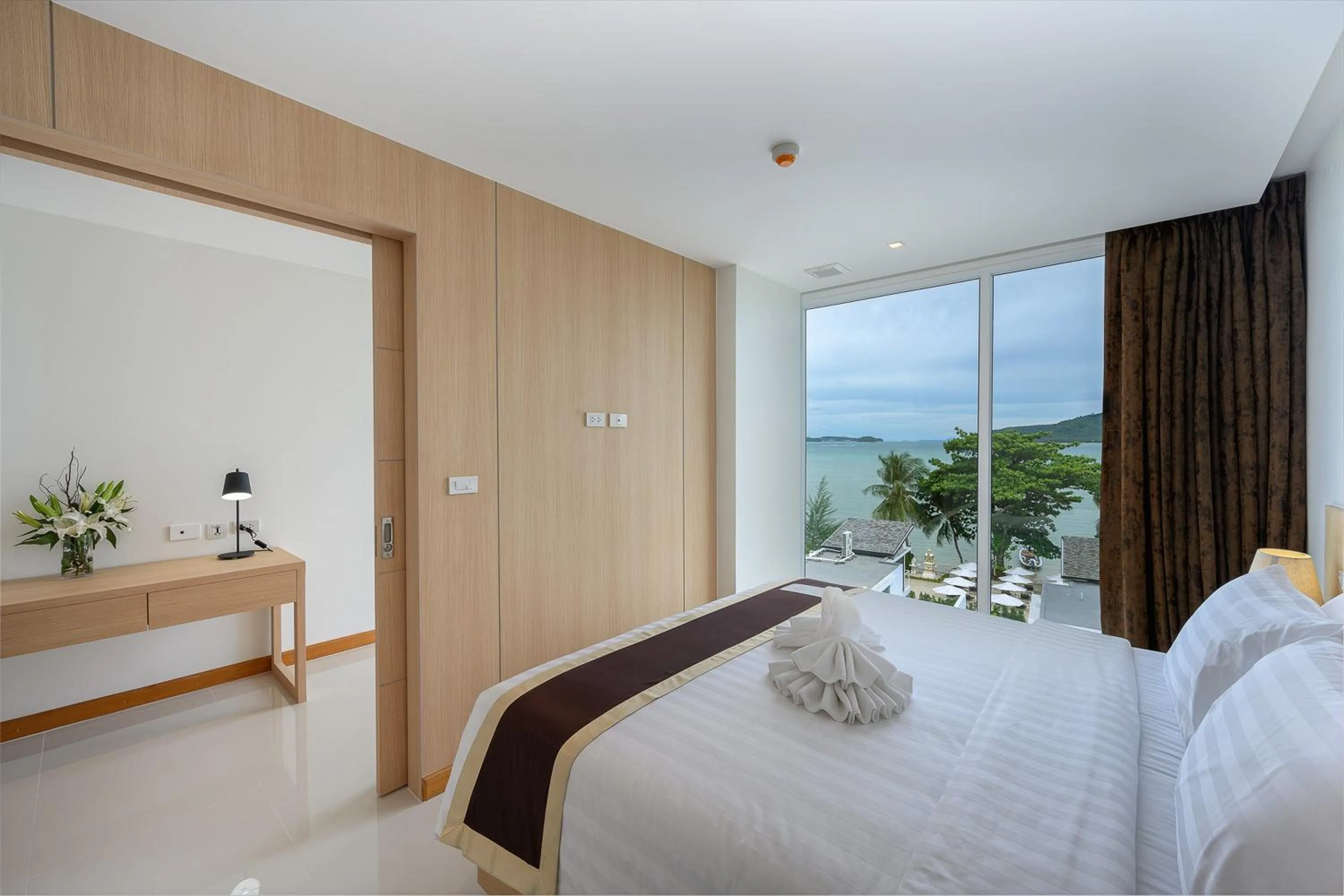 Bed in The Beachfront Hotel Phuket