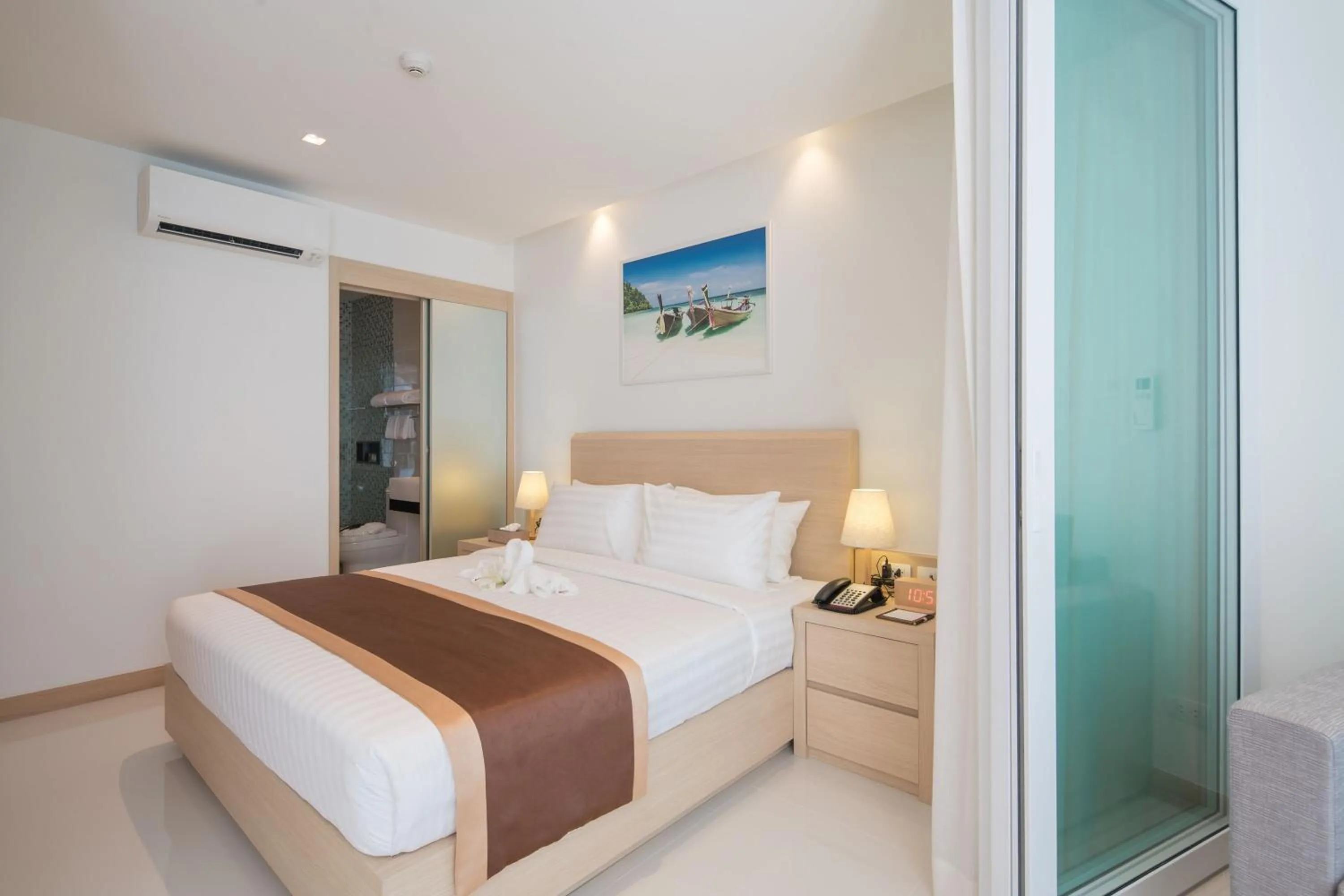 Bedroom in The Beachfront Hotel Phuket