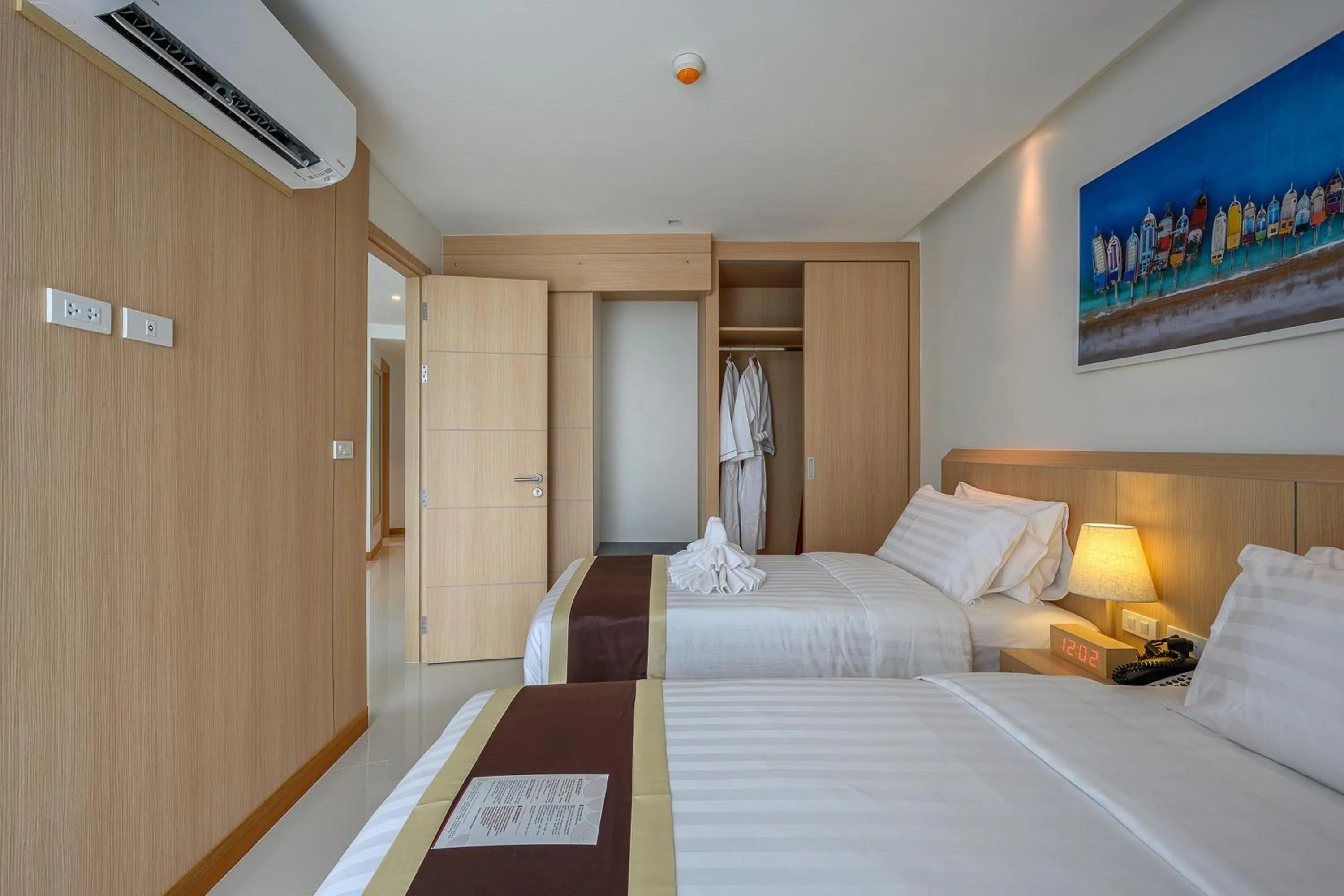 Bed in The Beachfront Hotel Phuket