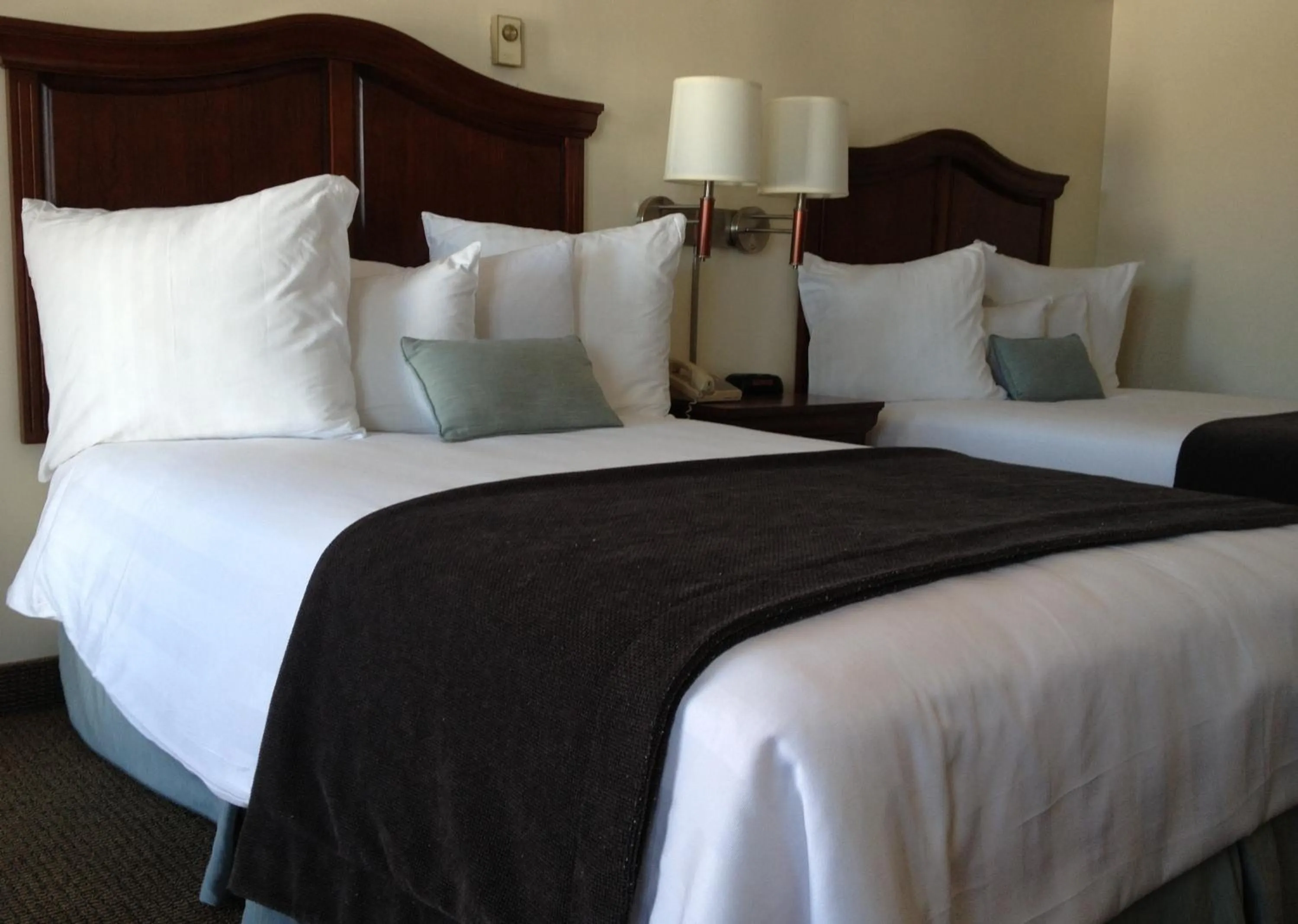 Bed in Holiday Hill Inn & Suites