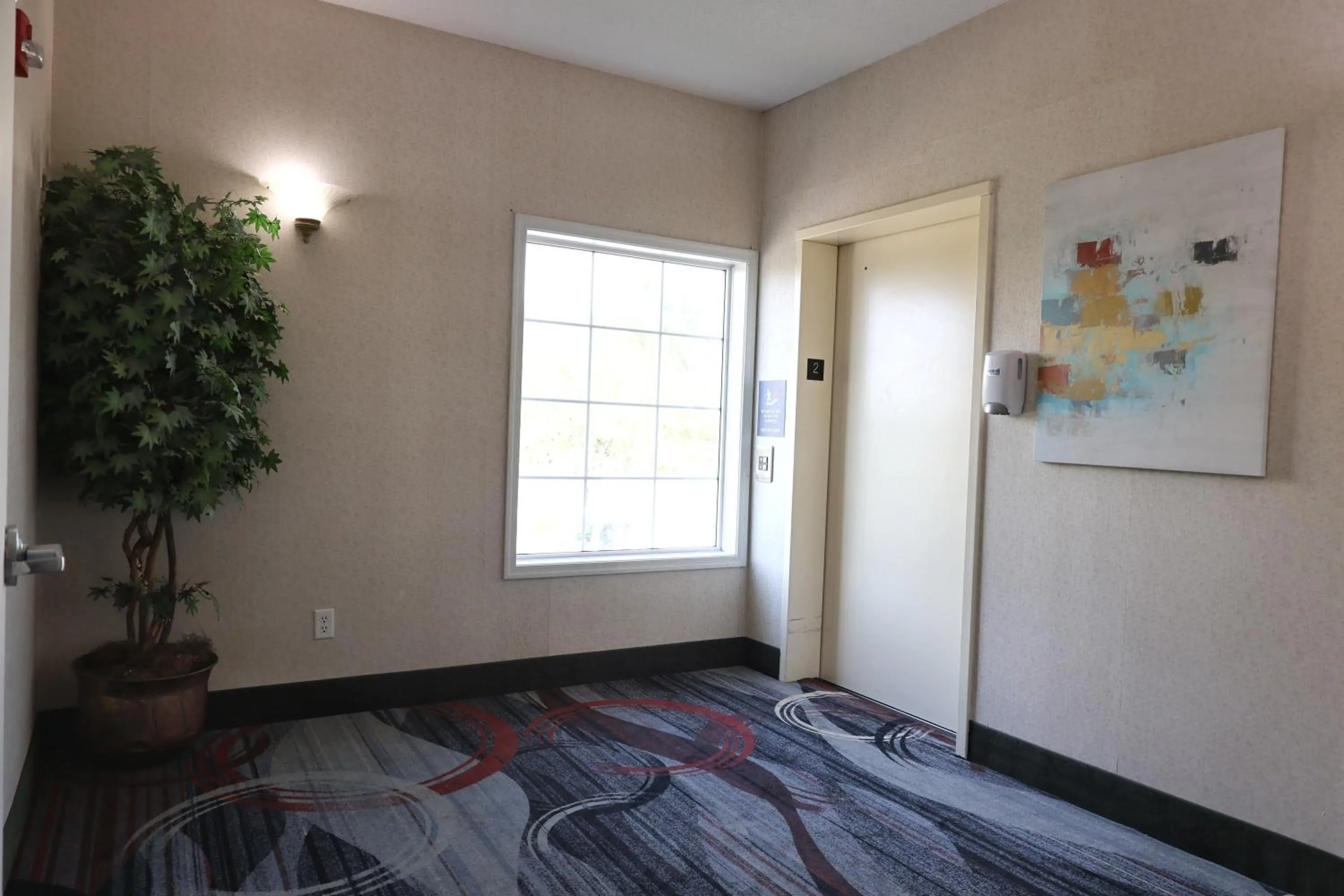 elevator, Bed in MainStay Suites Madison Airport