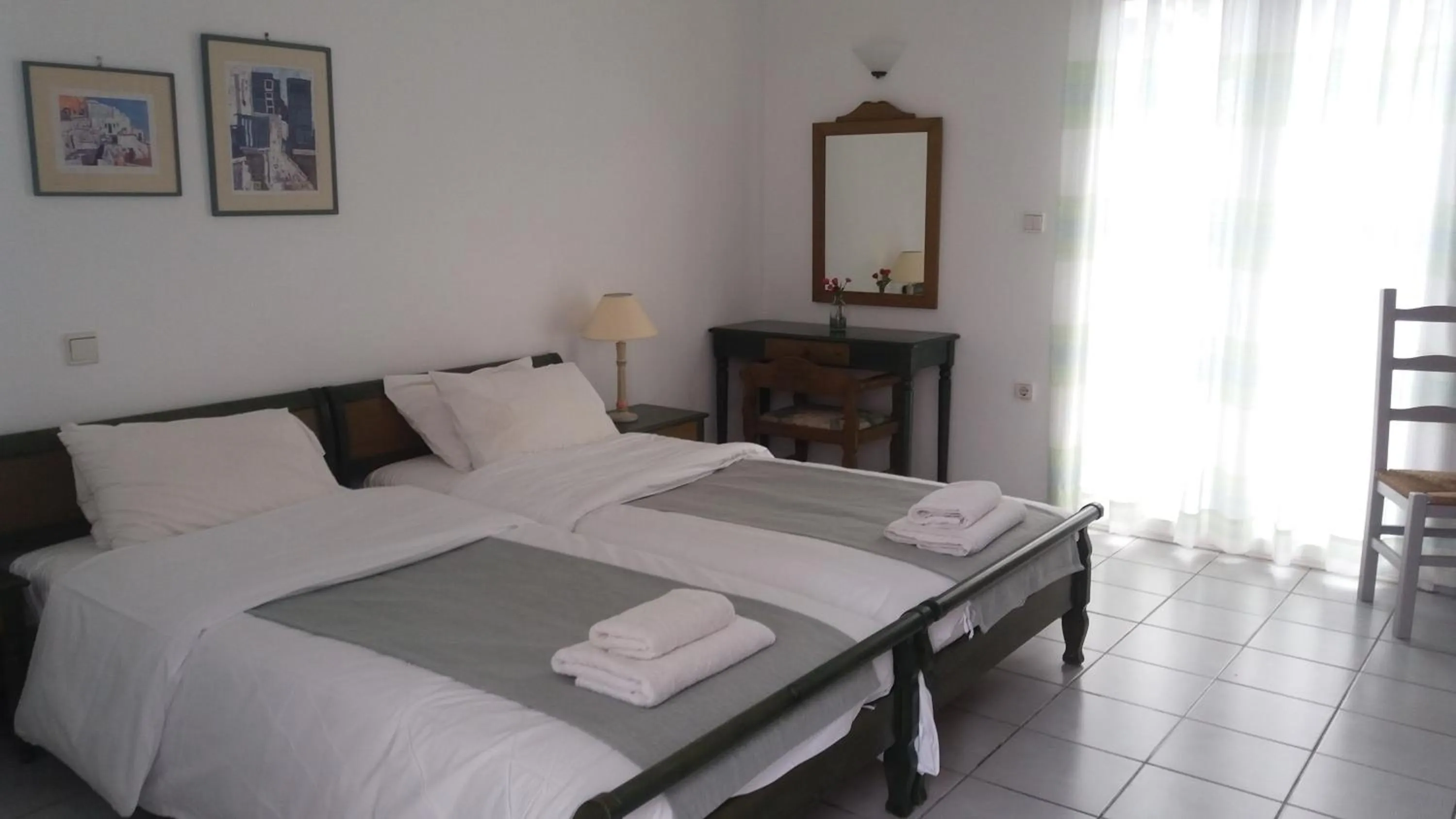 Bed in Astra Hotel Apartments