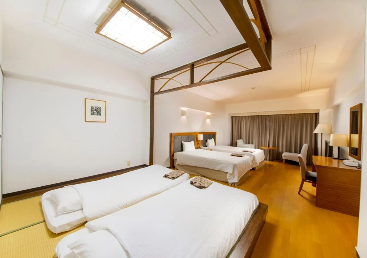 Photo of the whole room, Bed in Hotel Mahaina Wellness Resorts Okinawa