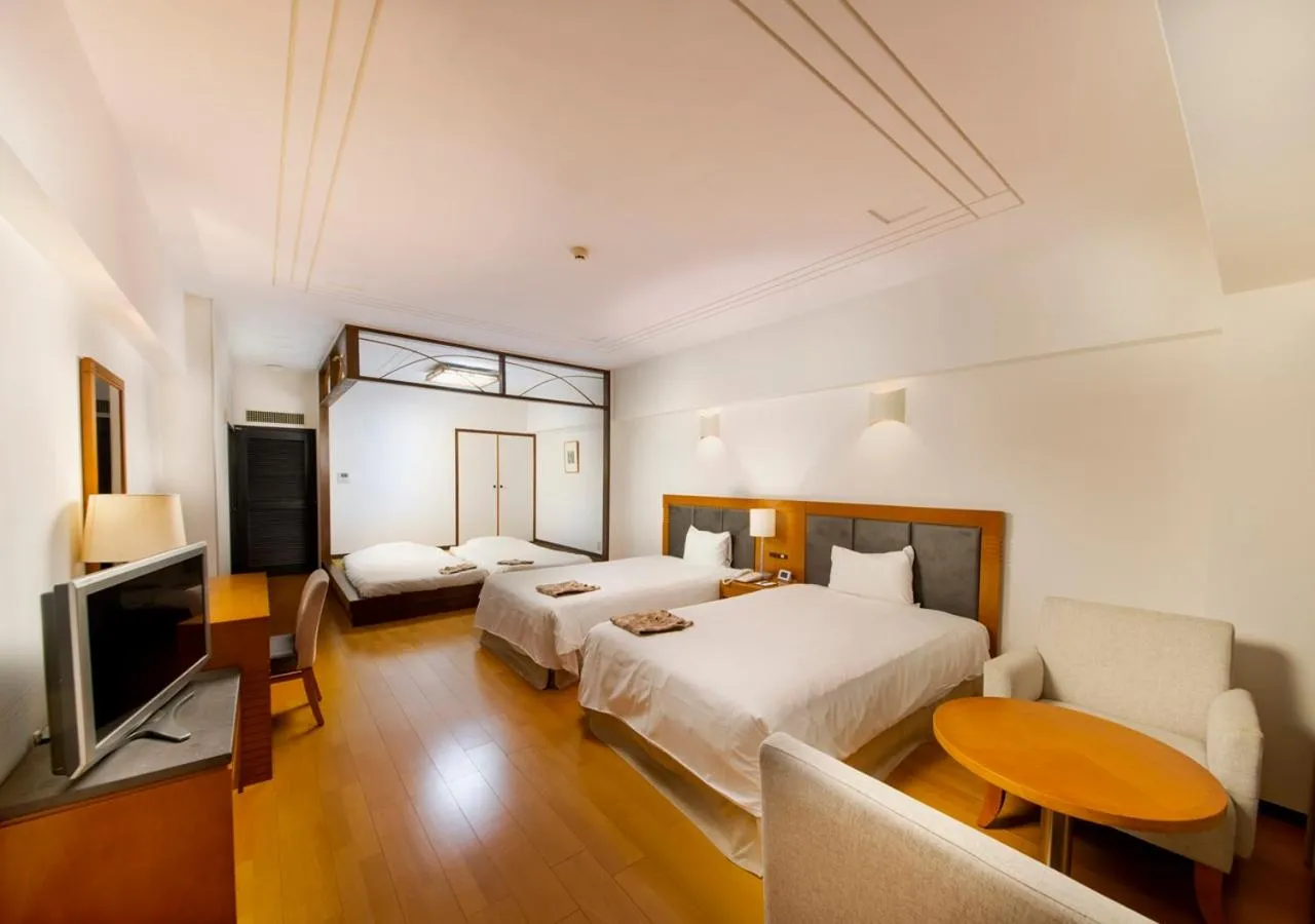 Photo of the whole room, Bed in Hotel Mahaina Wellness Resorts Okinawa