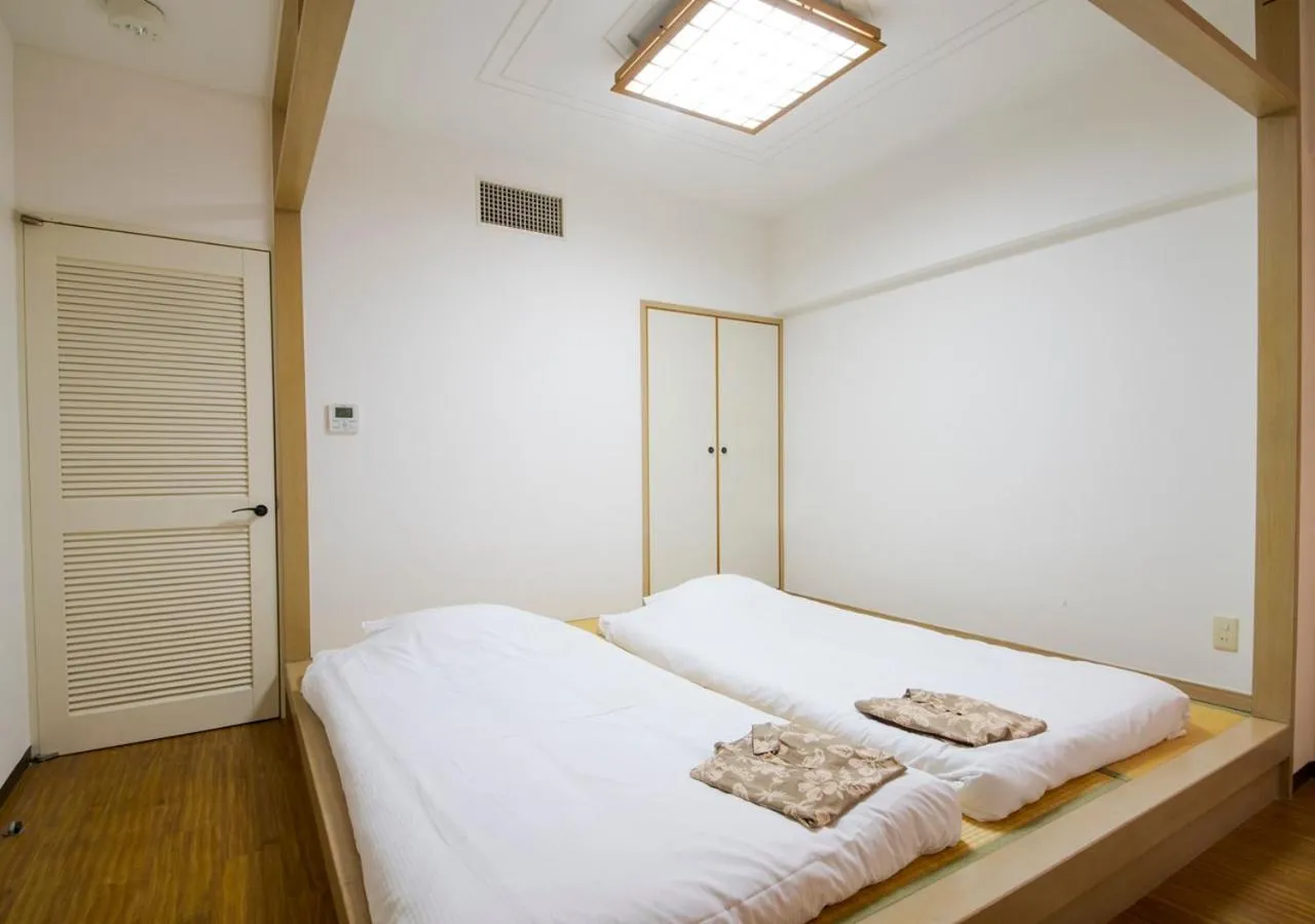 Photo of the whole room, Bed in Hotel Mahaina Wellness Resorts Okinawa