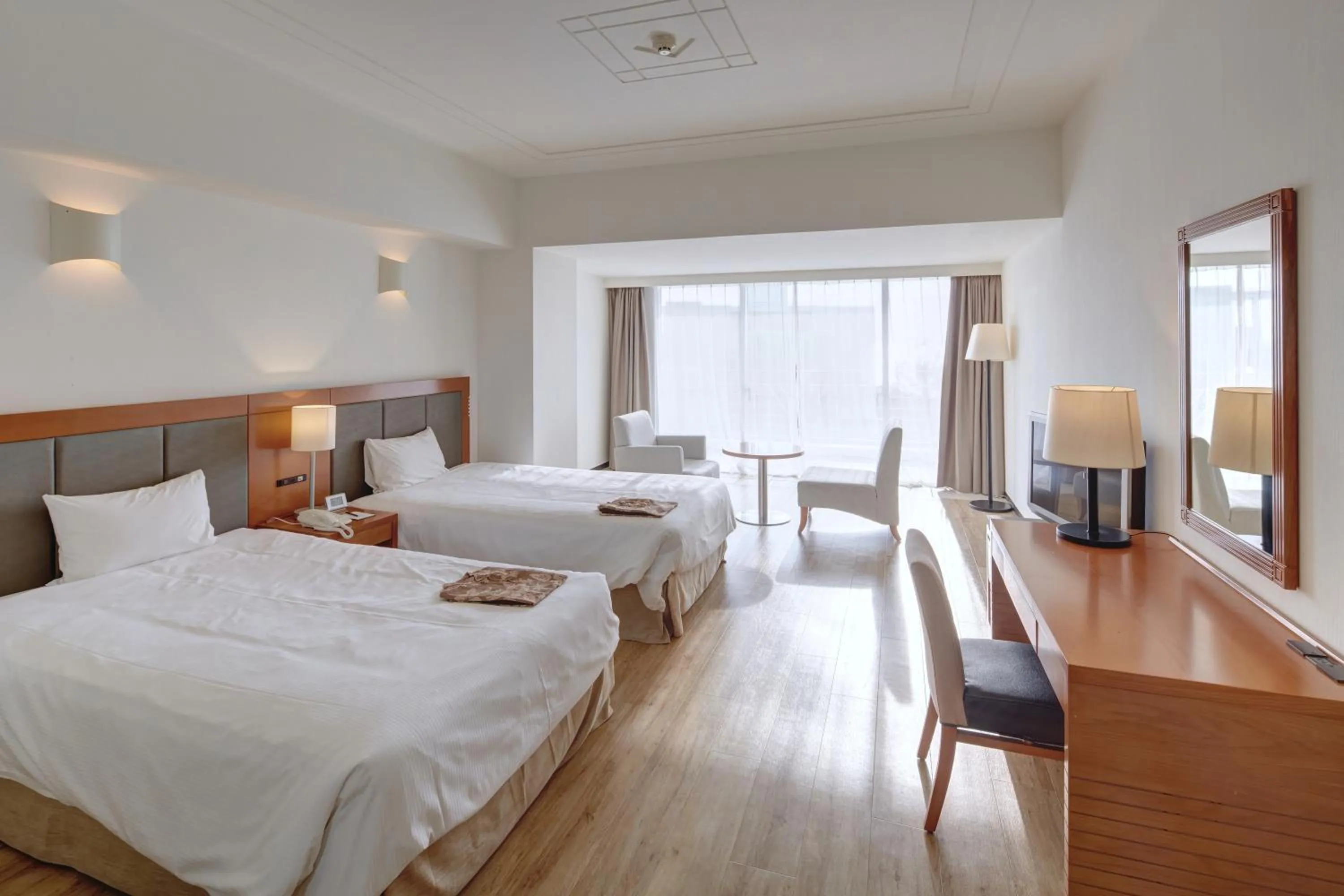 Bed in Hotel Mahaina Wellness Resorts Okinawa