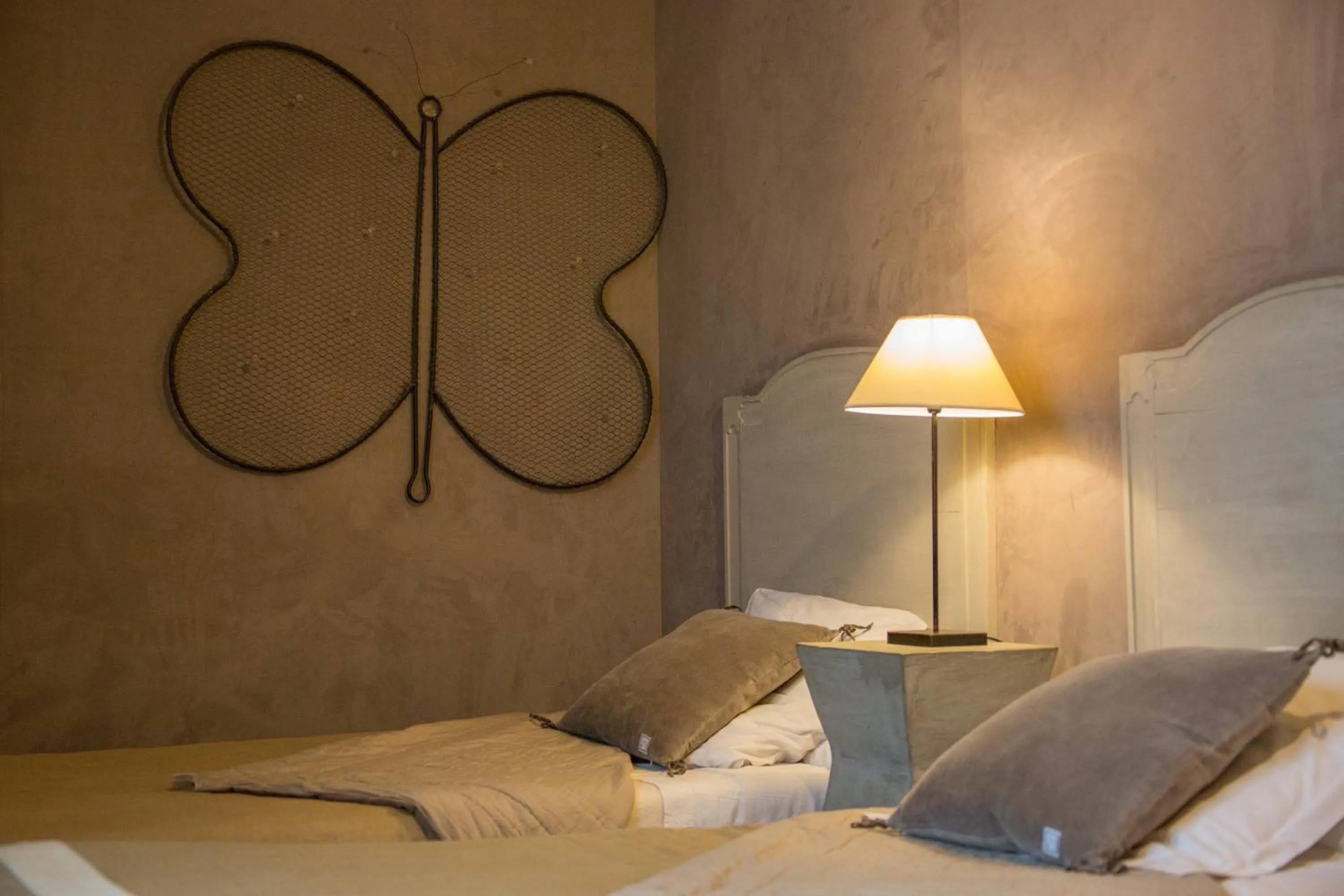 Bed in LogisHotels Le Relais du Quercy