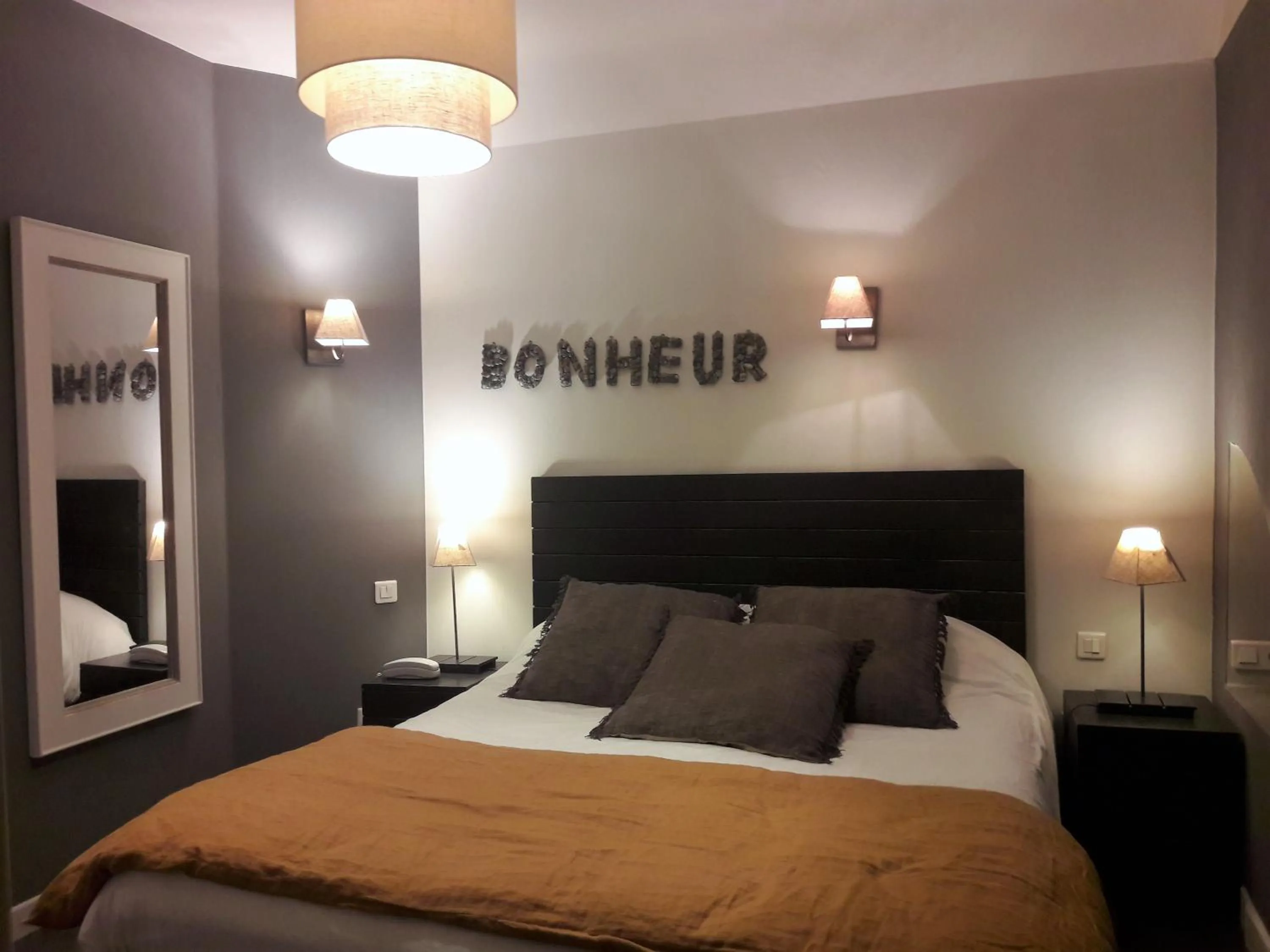 Bed in LogisHotels Le Relais du Quercy