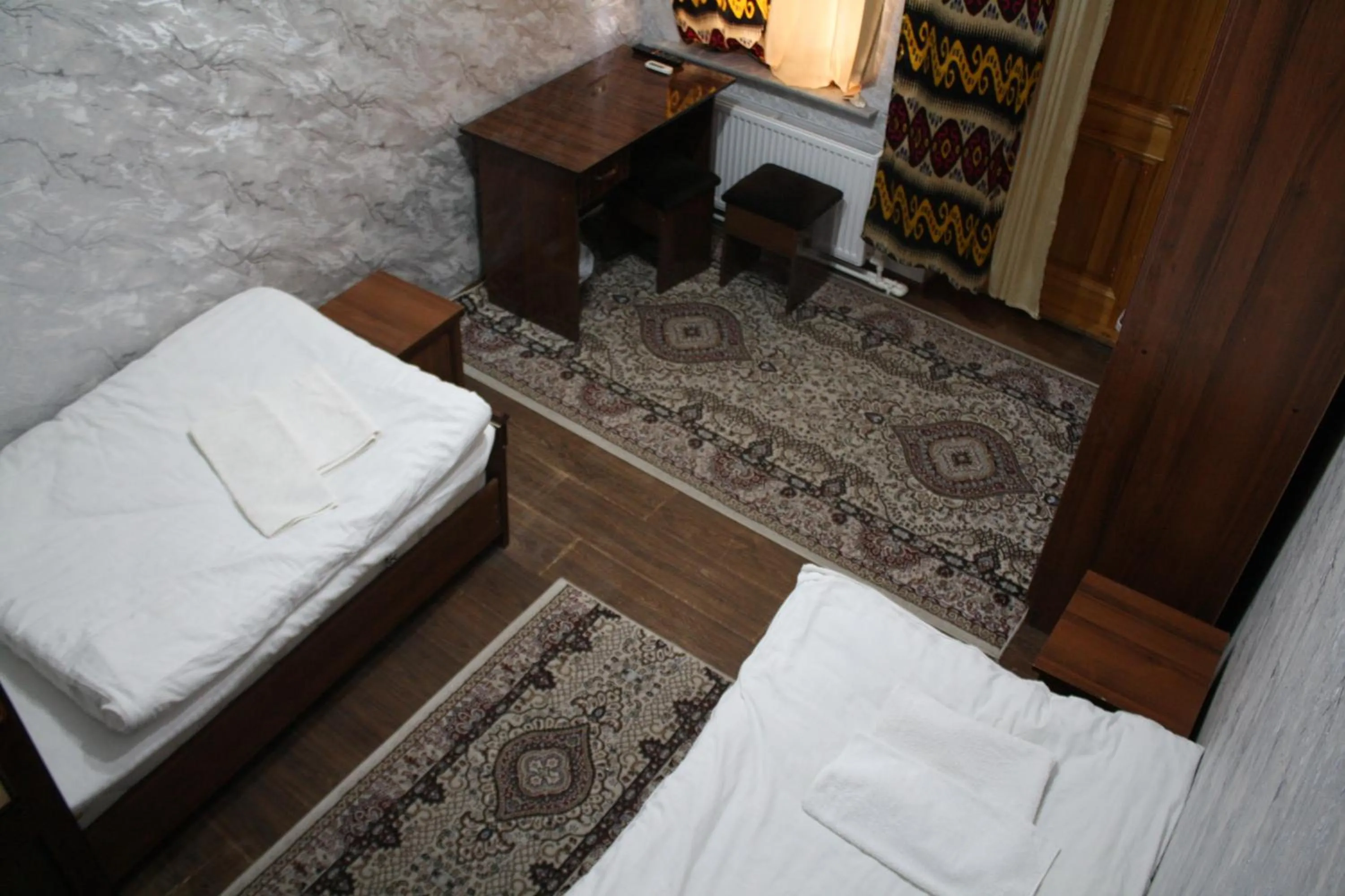 Bed in Tilyakori Hotel