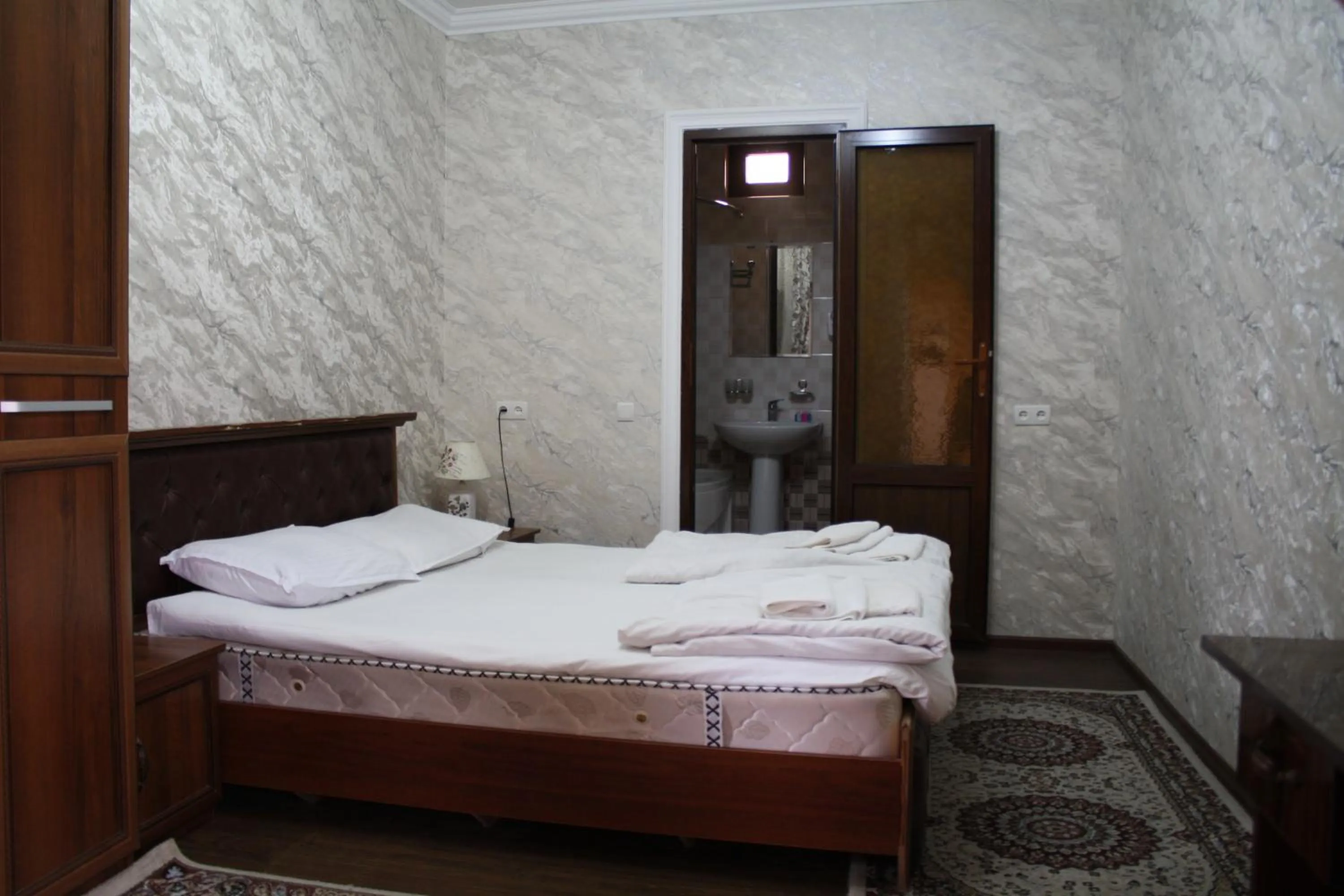 Bed in Tilyakori Hotel