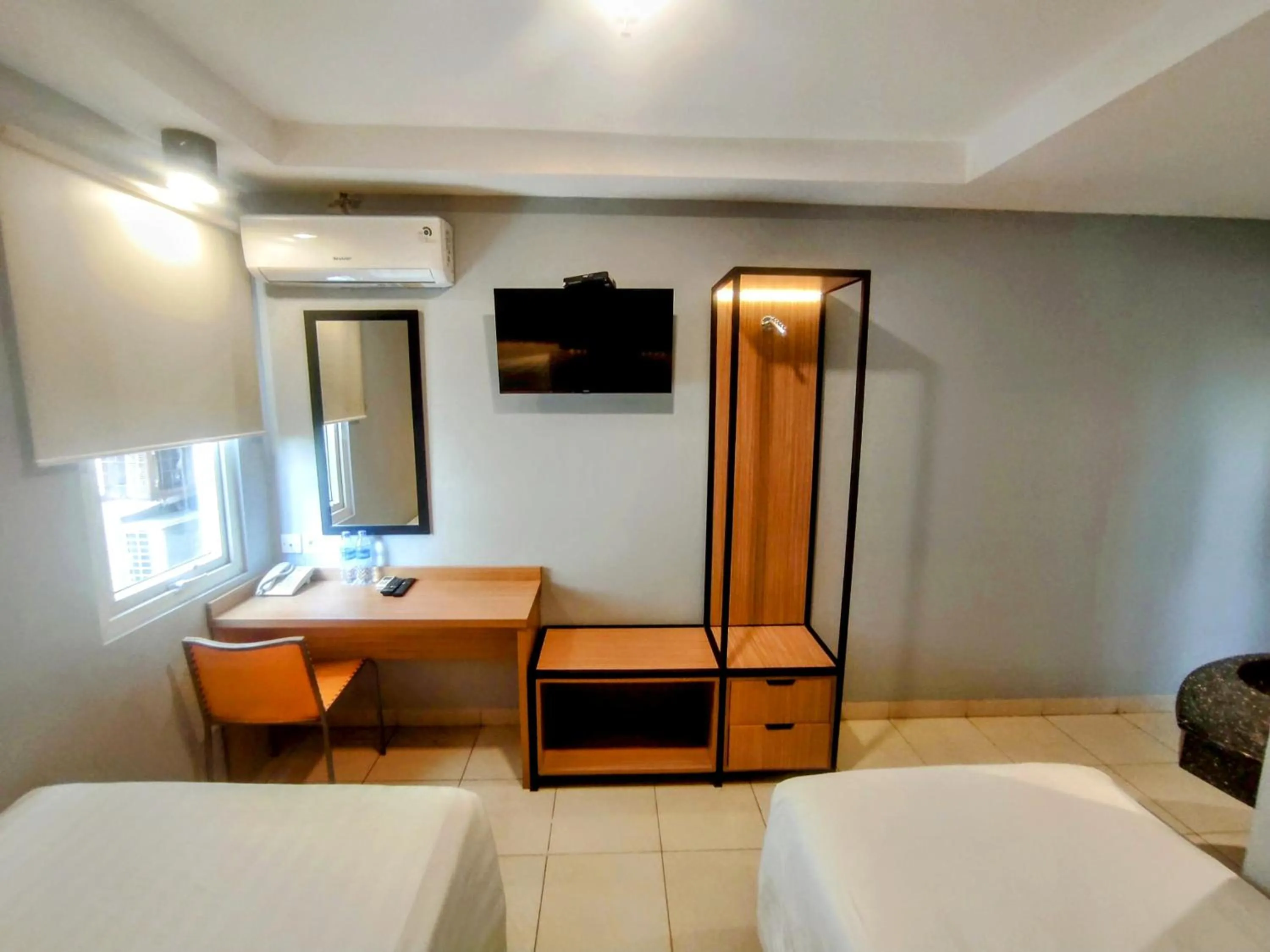 TV and multimedia, Bed in Studio One Thamrin Hotel