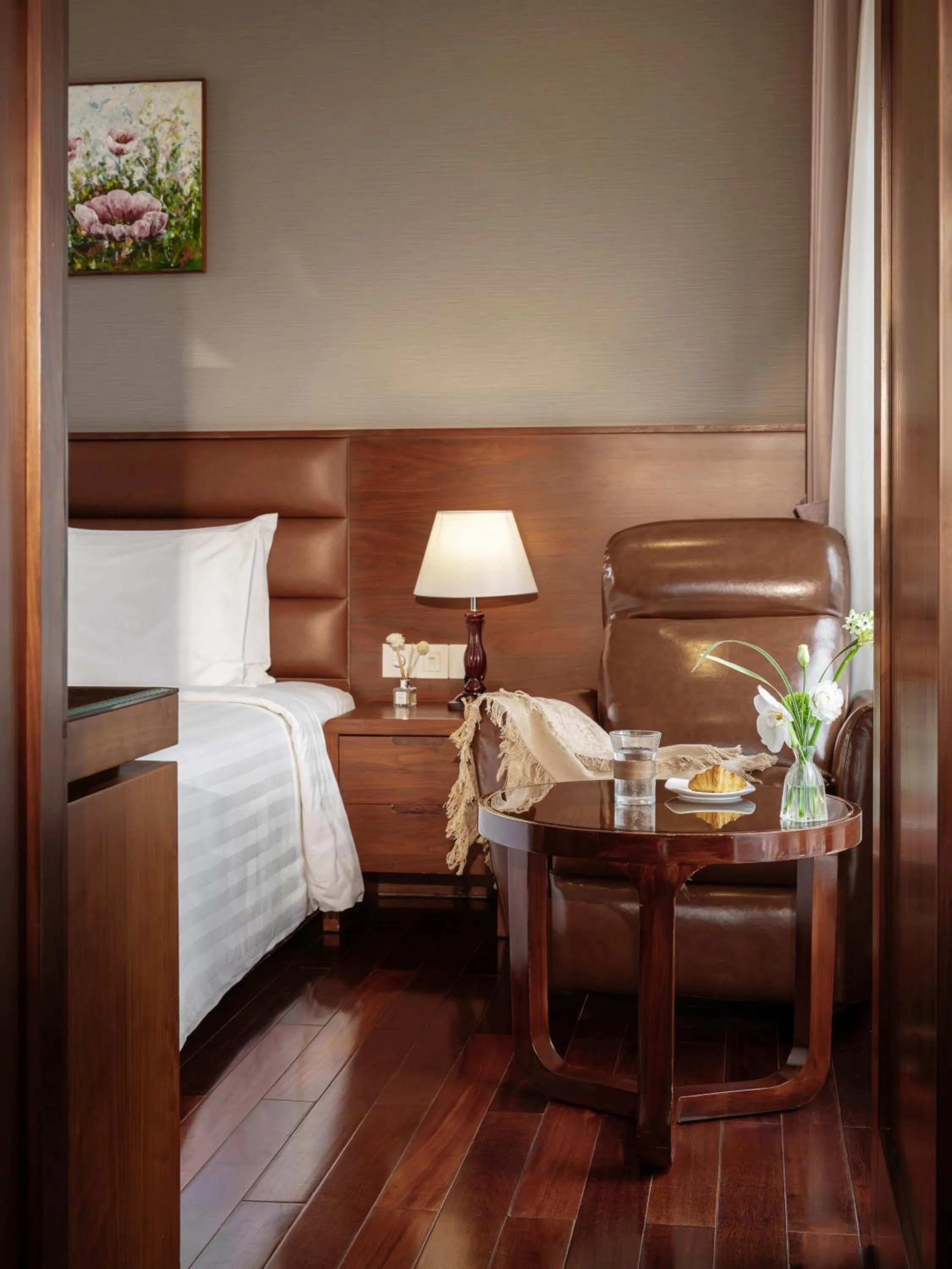 Bed in Orchids Saigon Hotel