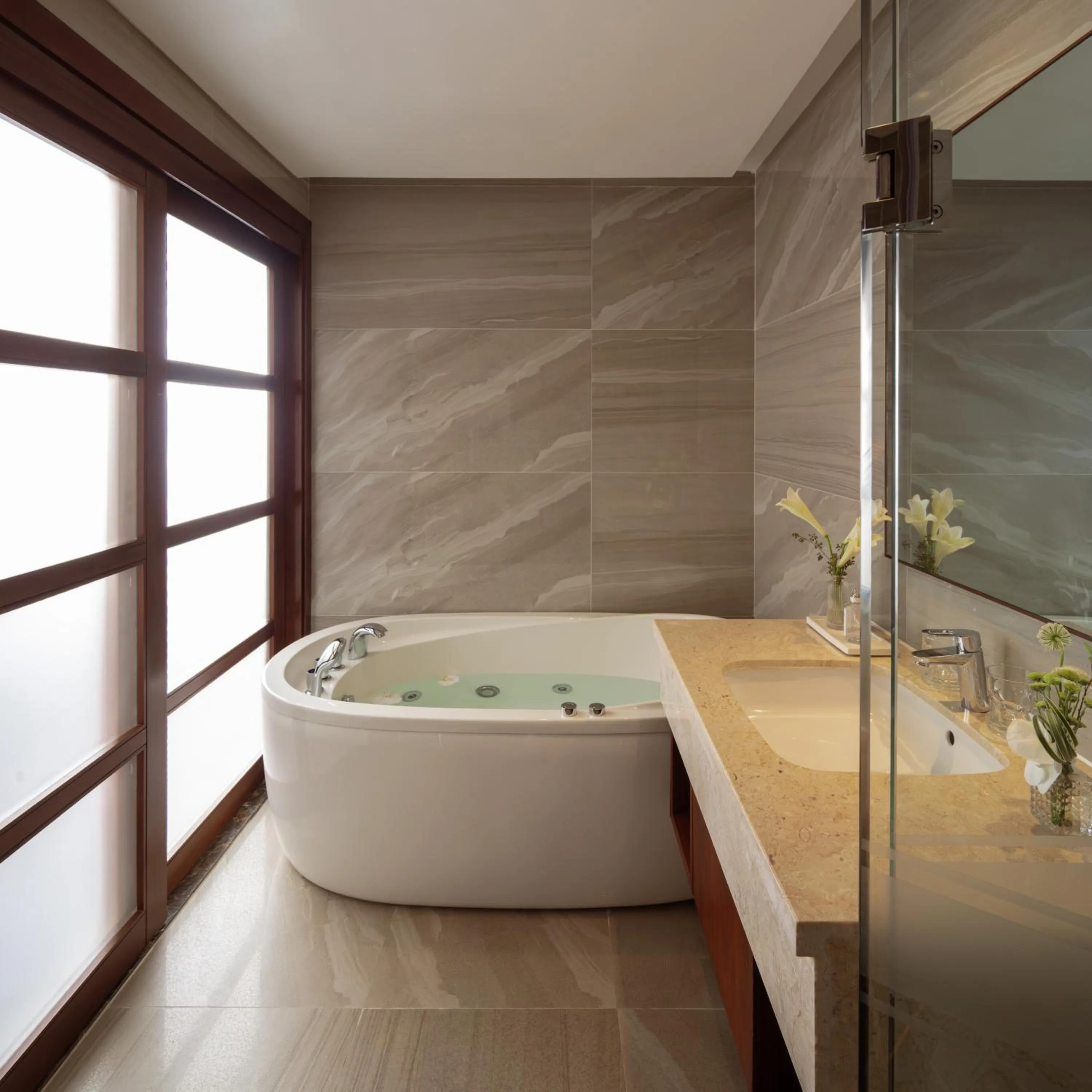 Bathroom in Orchids Saigon Hotel