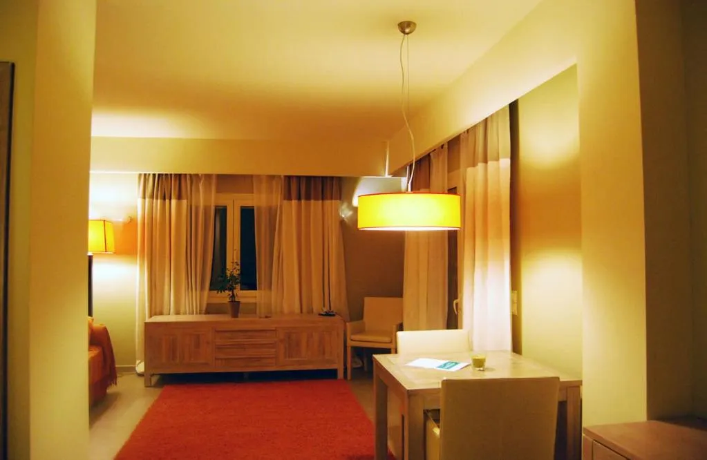 Living room, Bed in Astrolabe Hotel