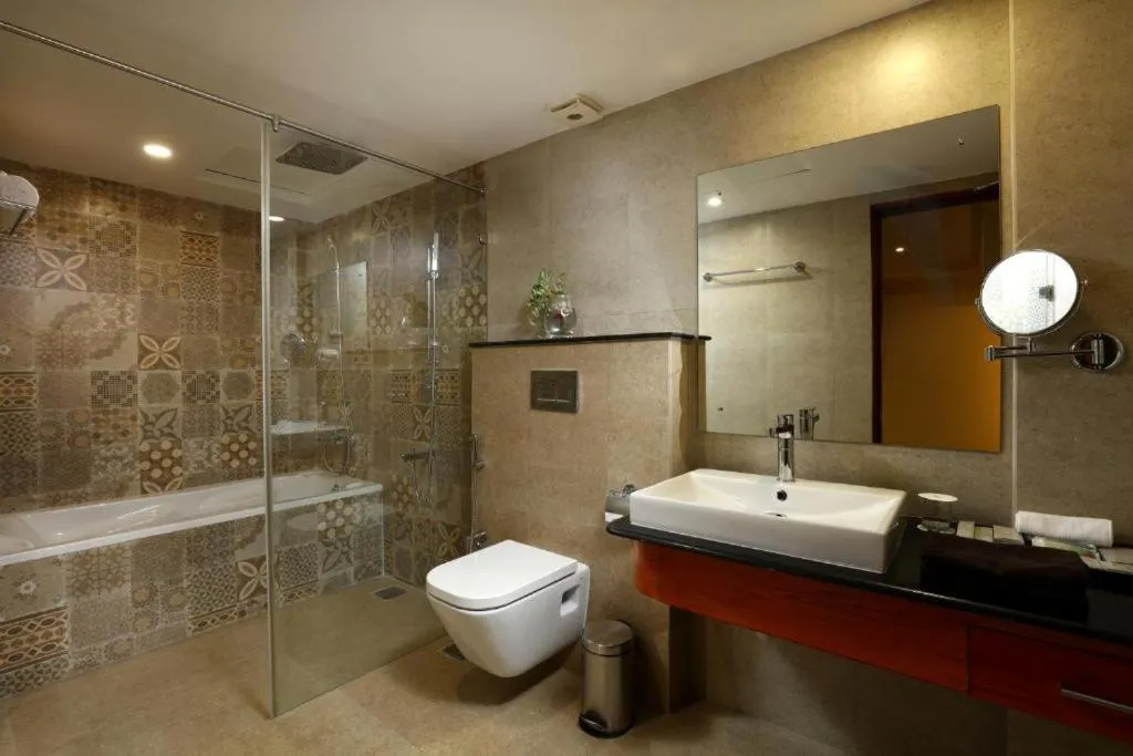 Bathroom in JVK Park Hotel