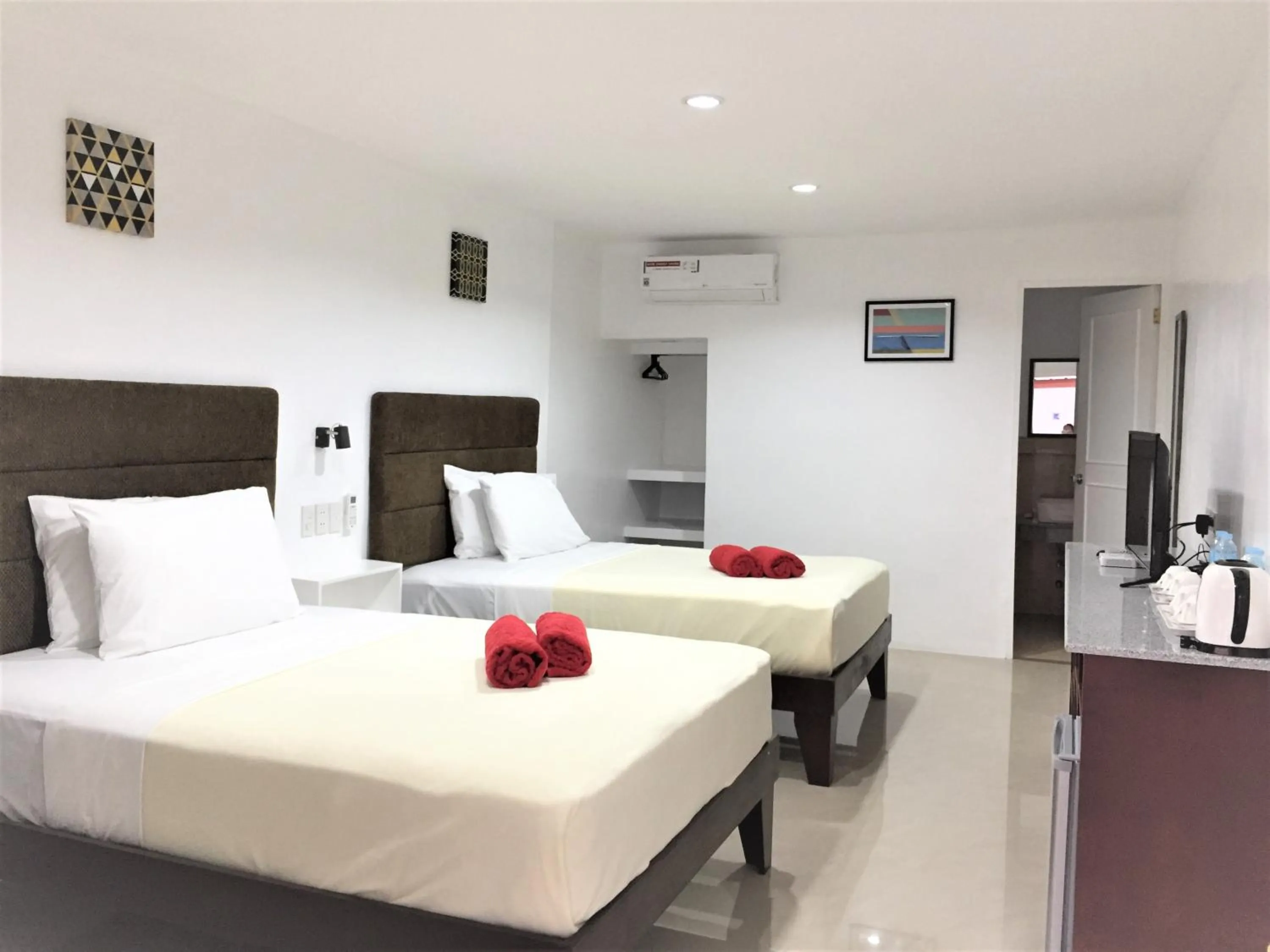 Bed in Heartland Hotel Serviced Rooms & Apartments.