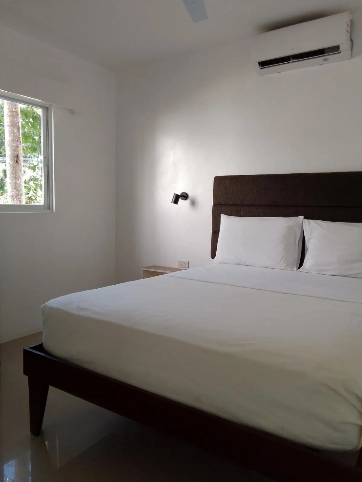 Bed in Heartland Hotel Serviced Rooms & Apartments.