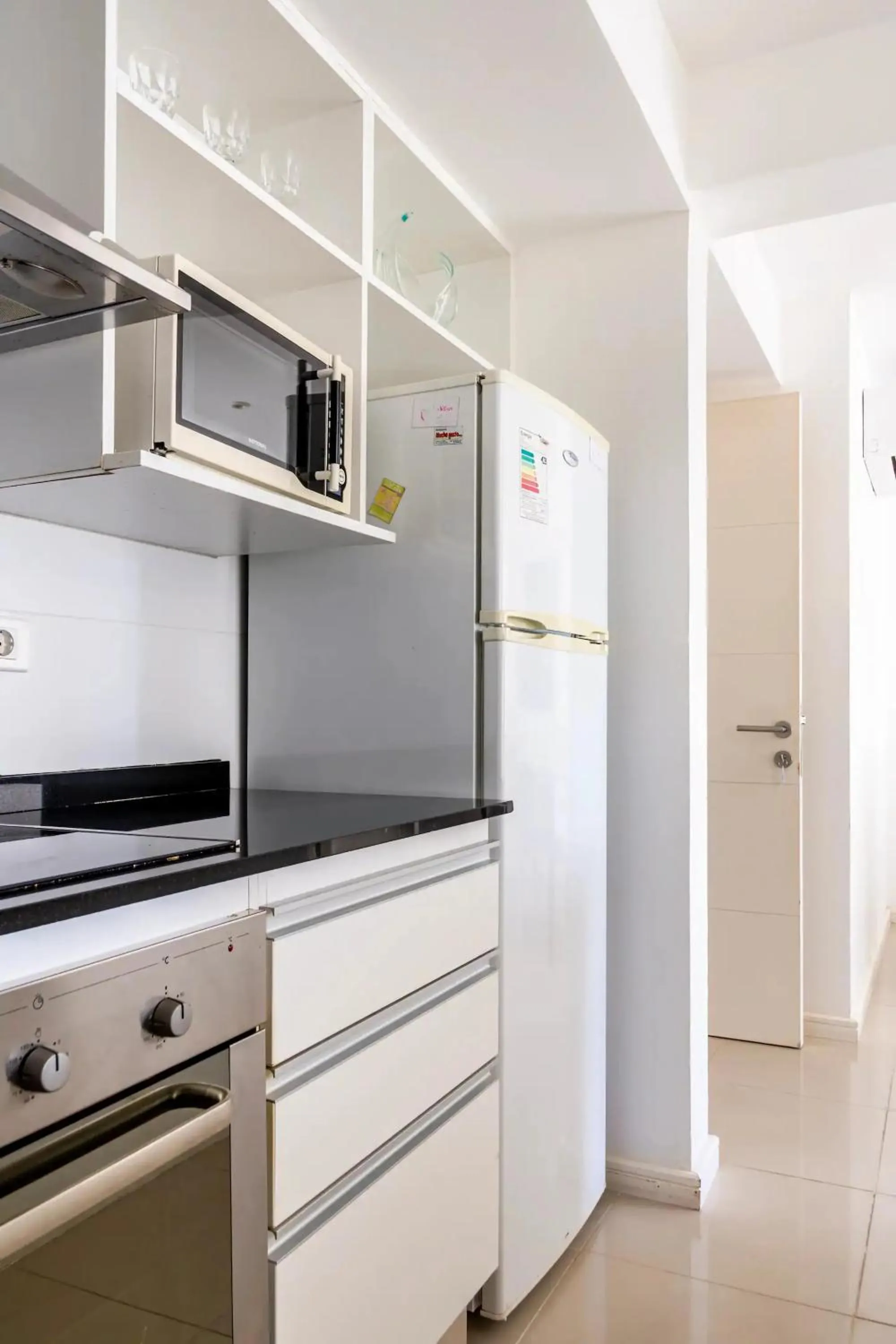 Kitchen or kitchenette in Arenas del Mar Apartments