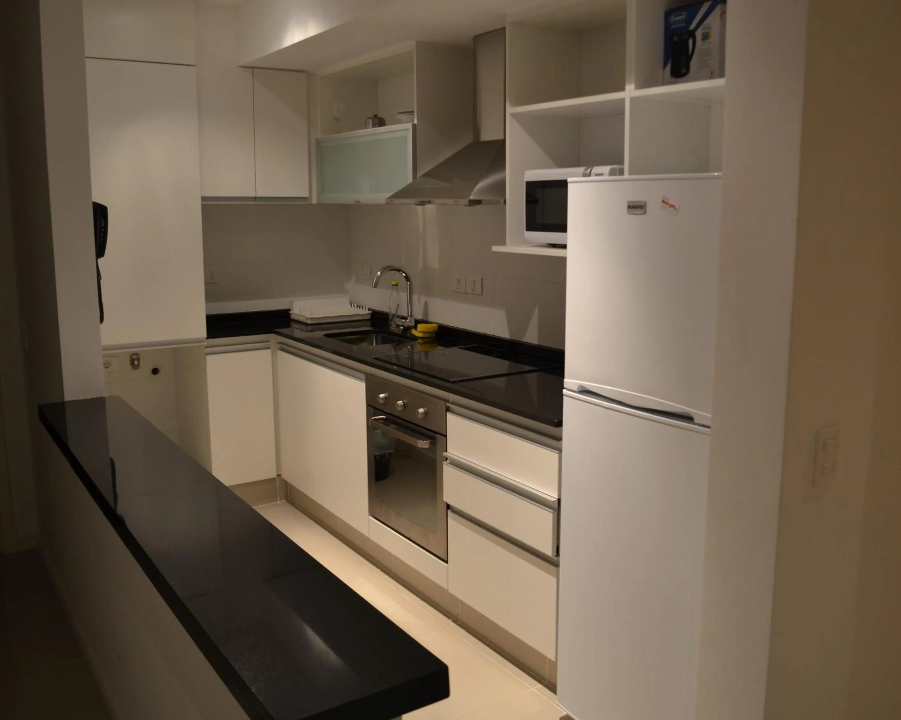 Kitchen or kitchenette in Arenas del Mar Apartments