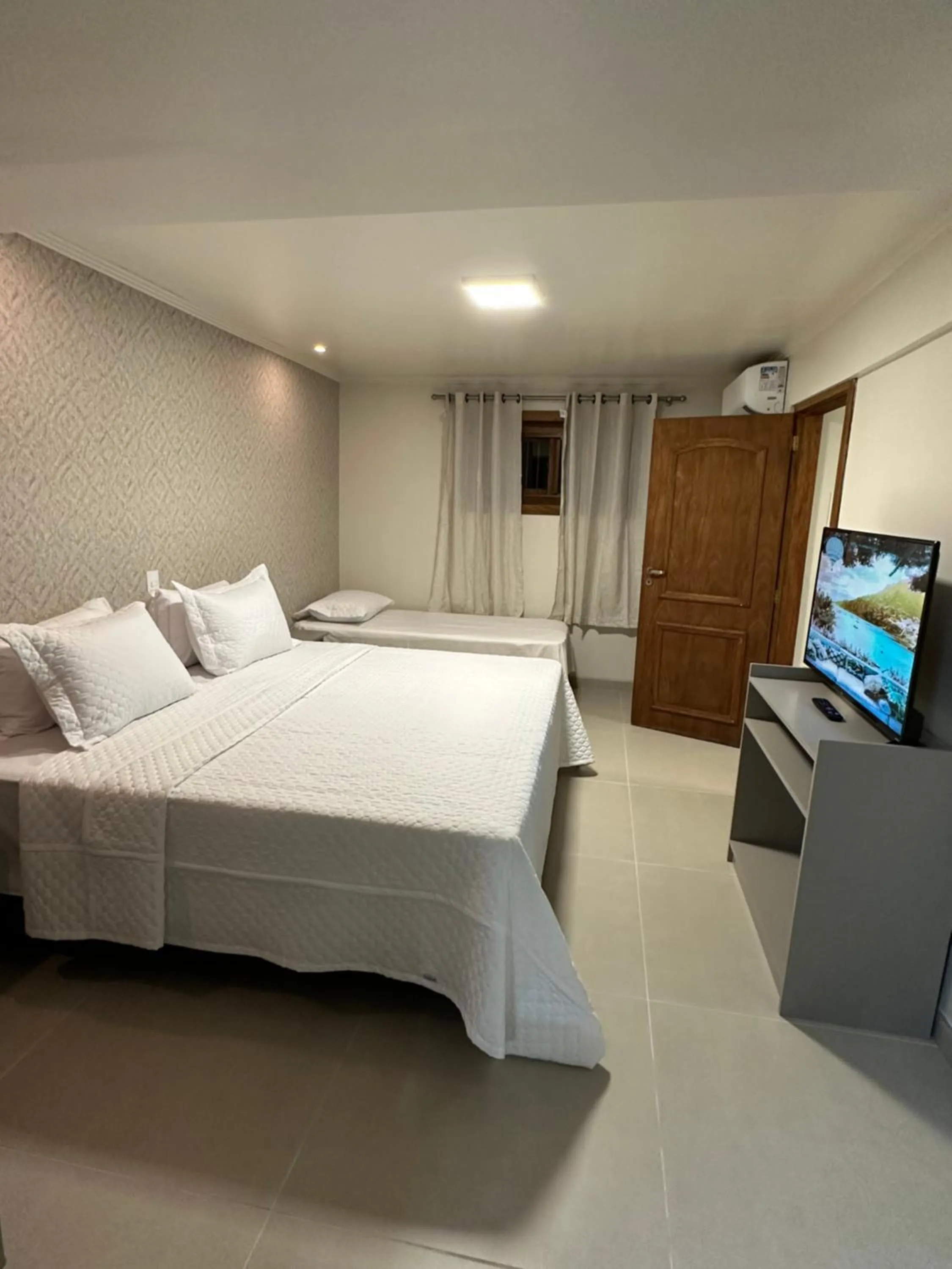 Bed in Pousada Villa Verde