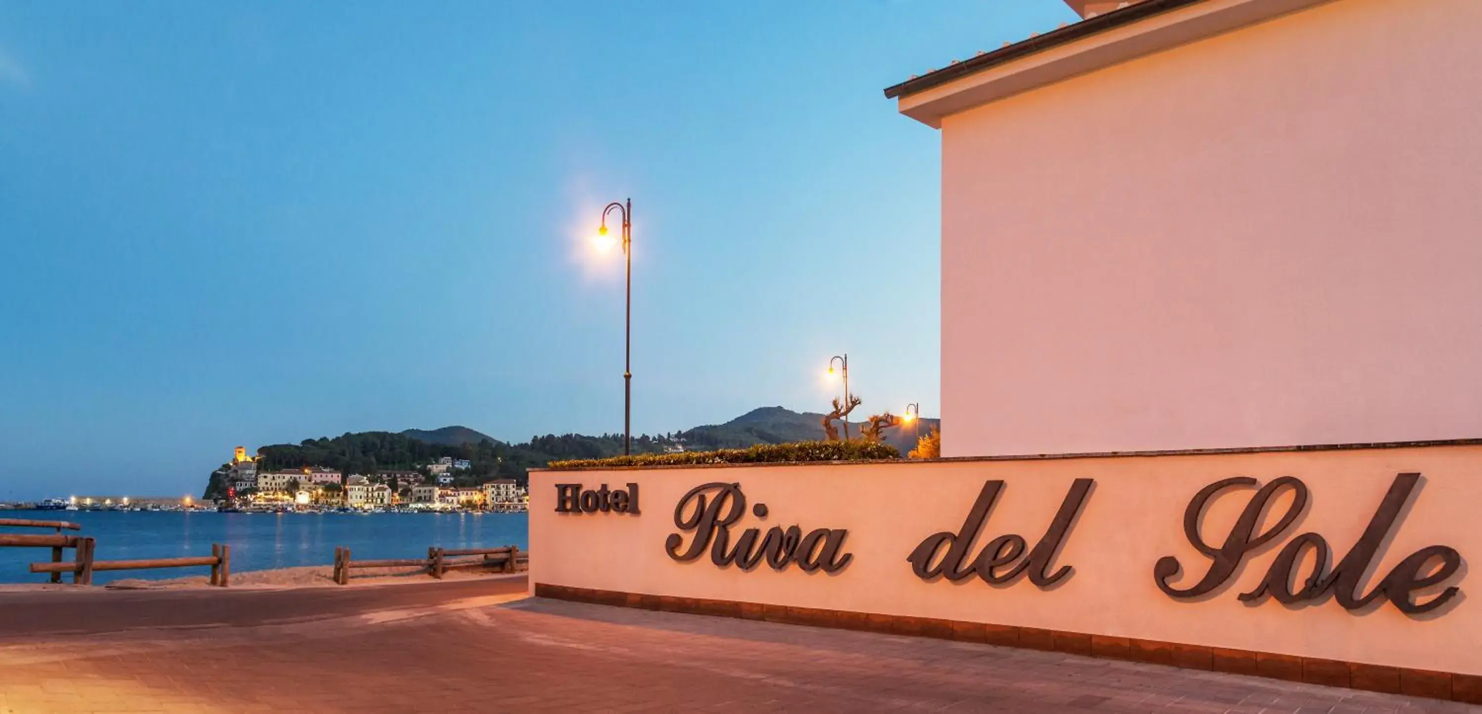 Property logo or sign in Hotel Riva del Sole Property logo or sign in Hotel Riva del Sole