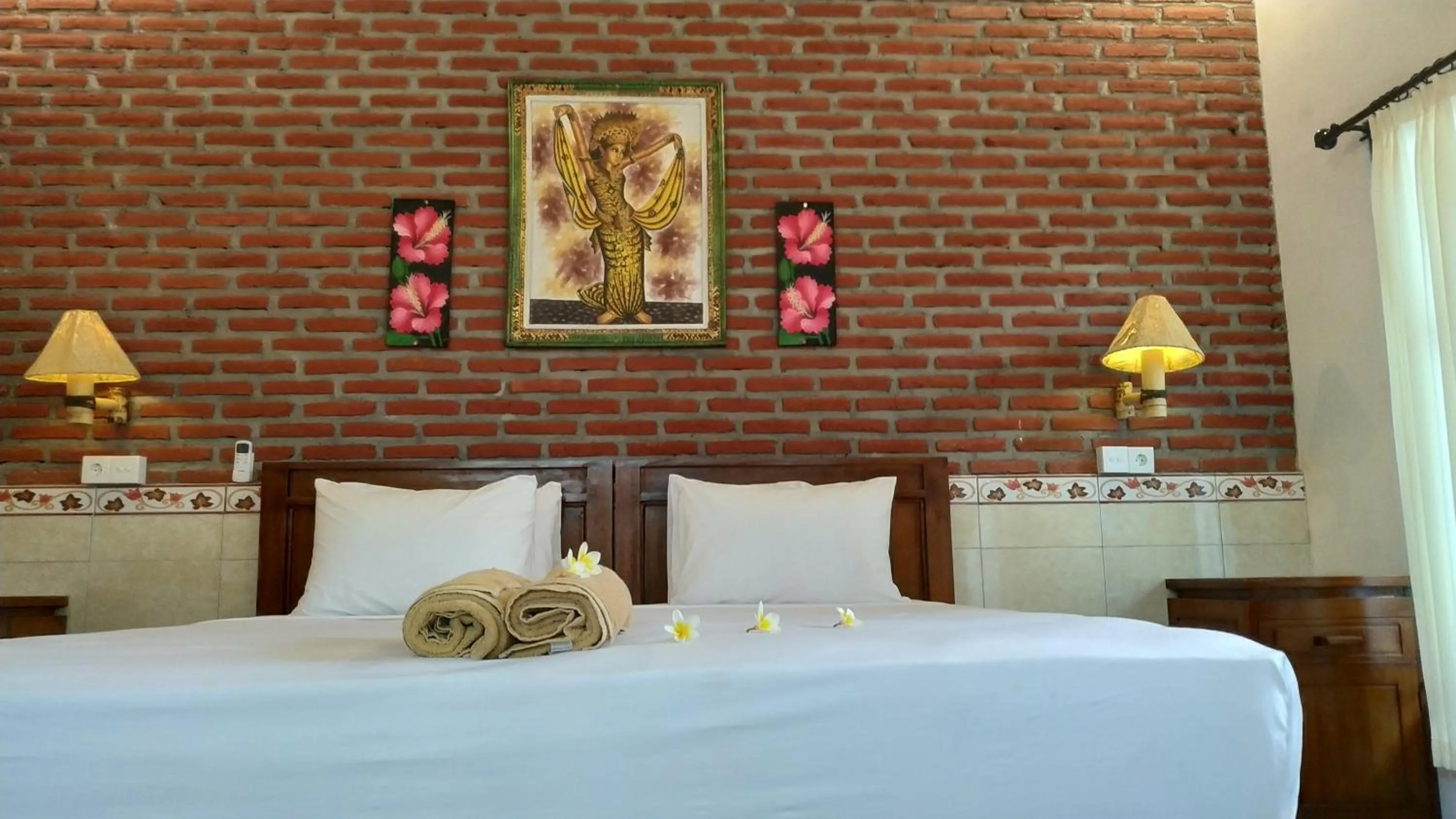 Bed in Eliska Sari Bungalows Sumberkima