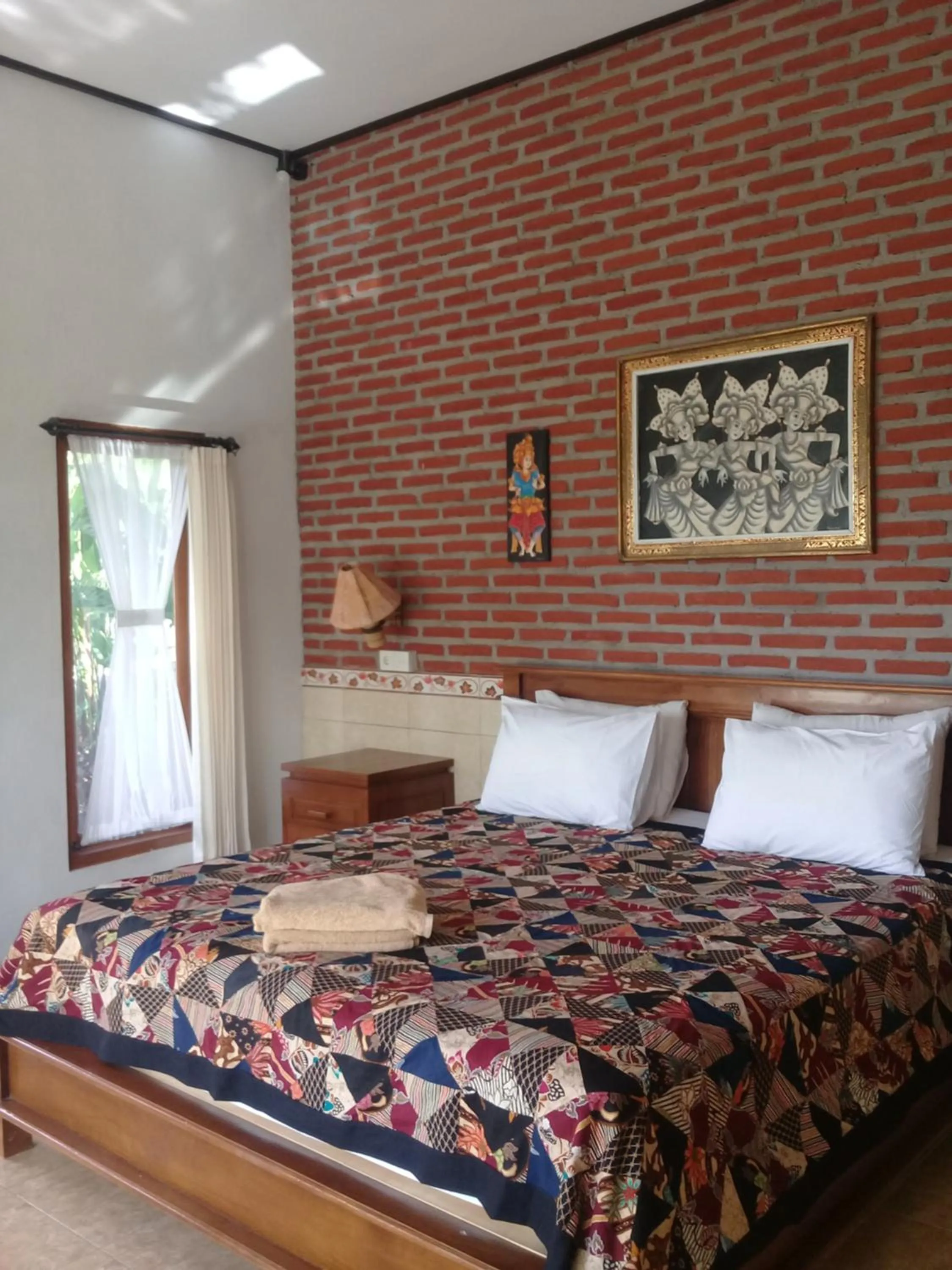 Bed in Eliska Sari Bungalows Sumberkima