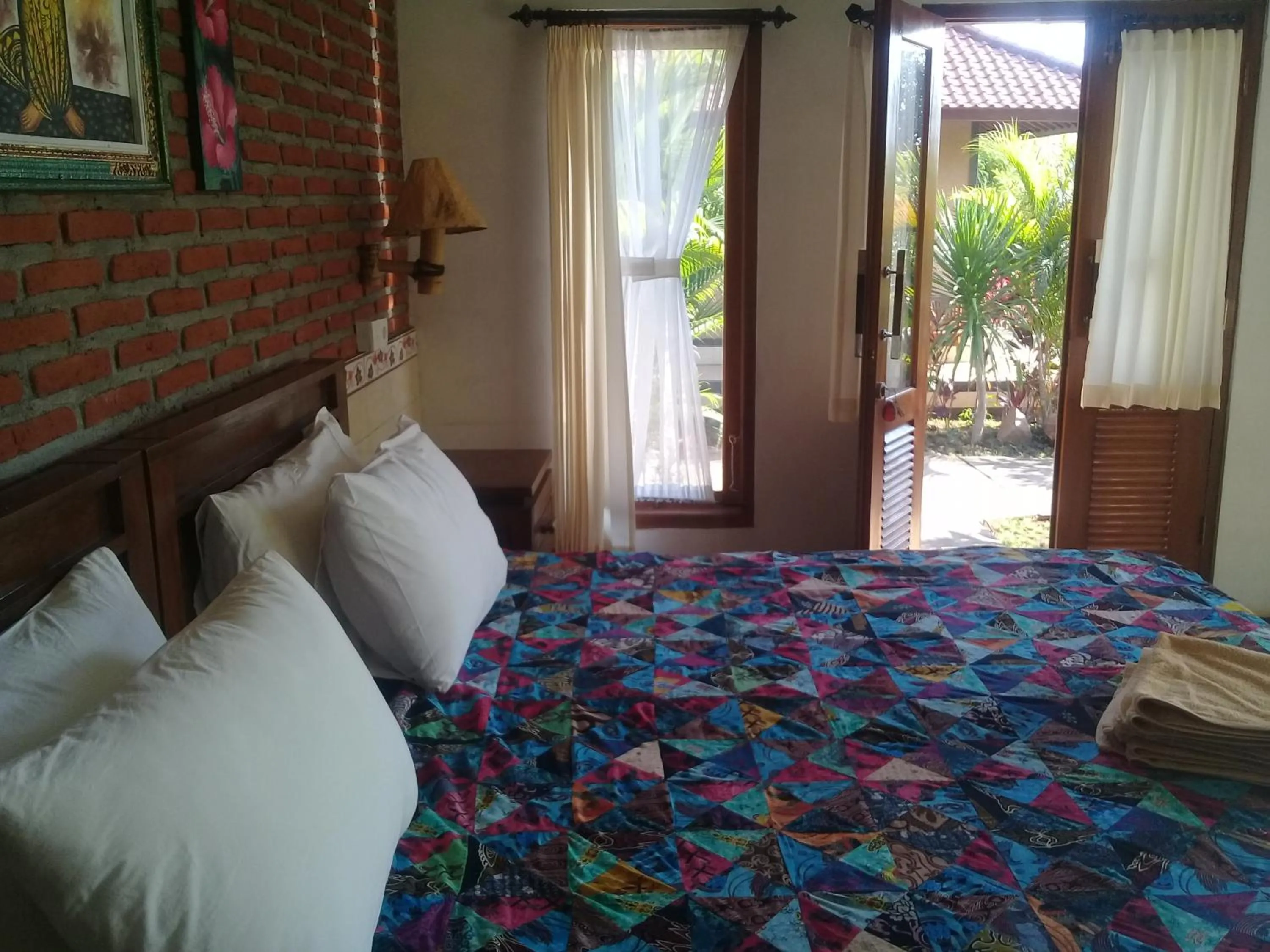 Bed in Eliska Sari Bungalows Sumberkima