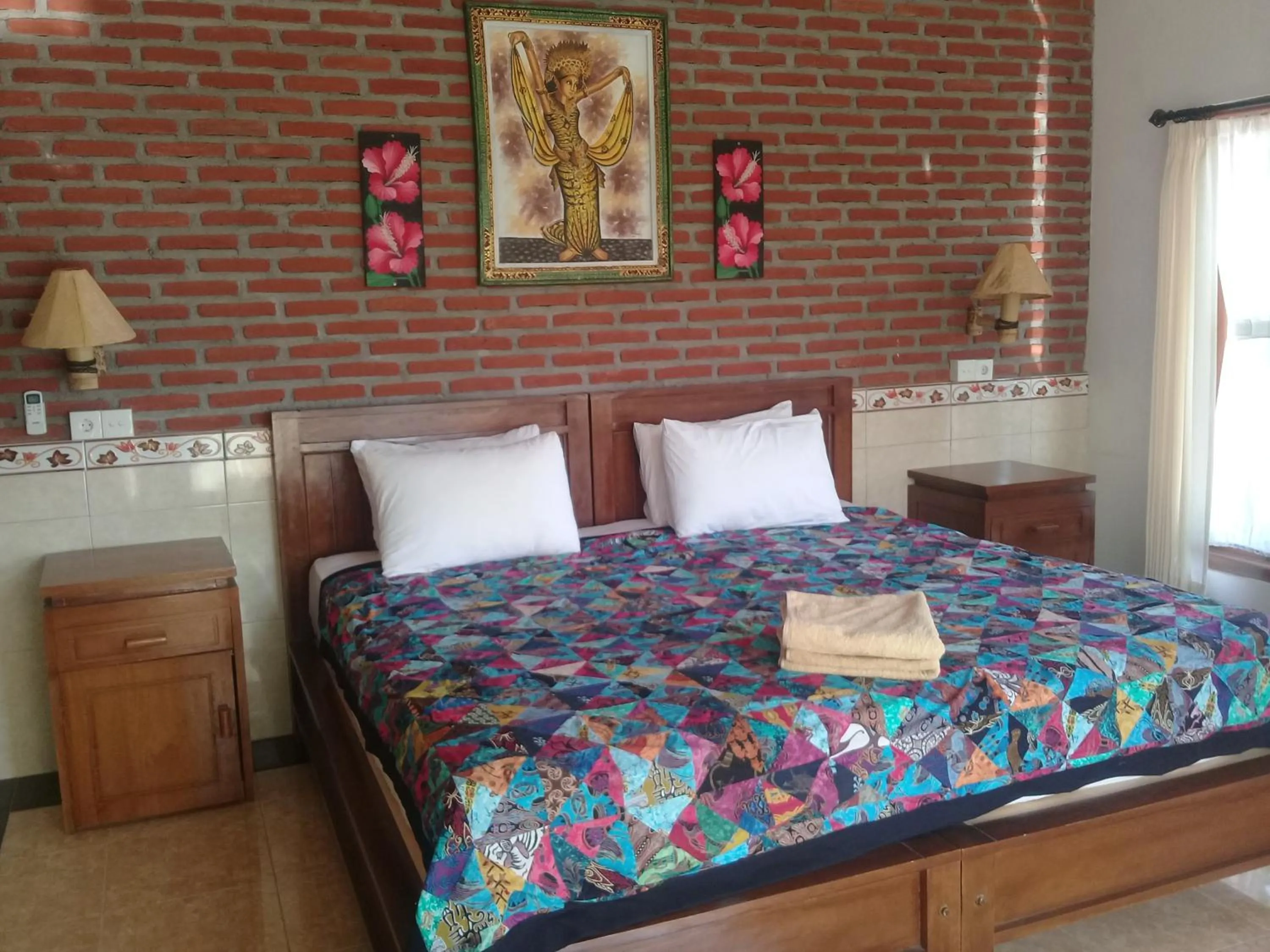 Bed in Eliska Sari Bungalows Sumberkima