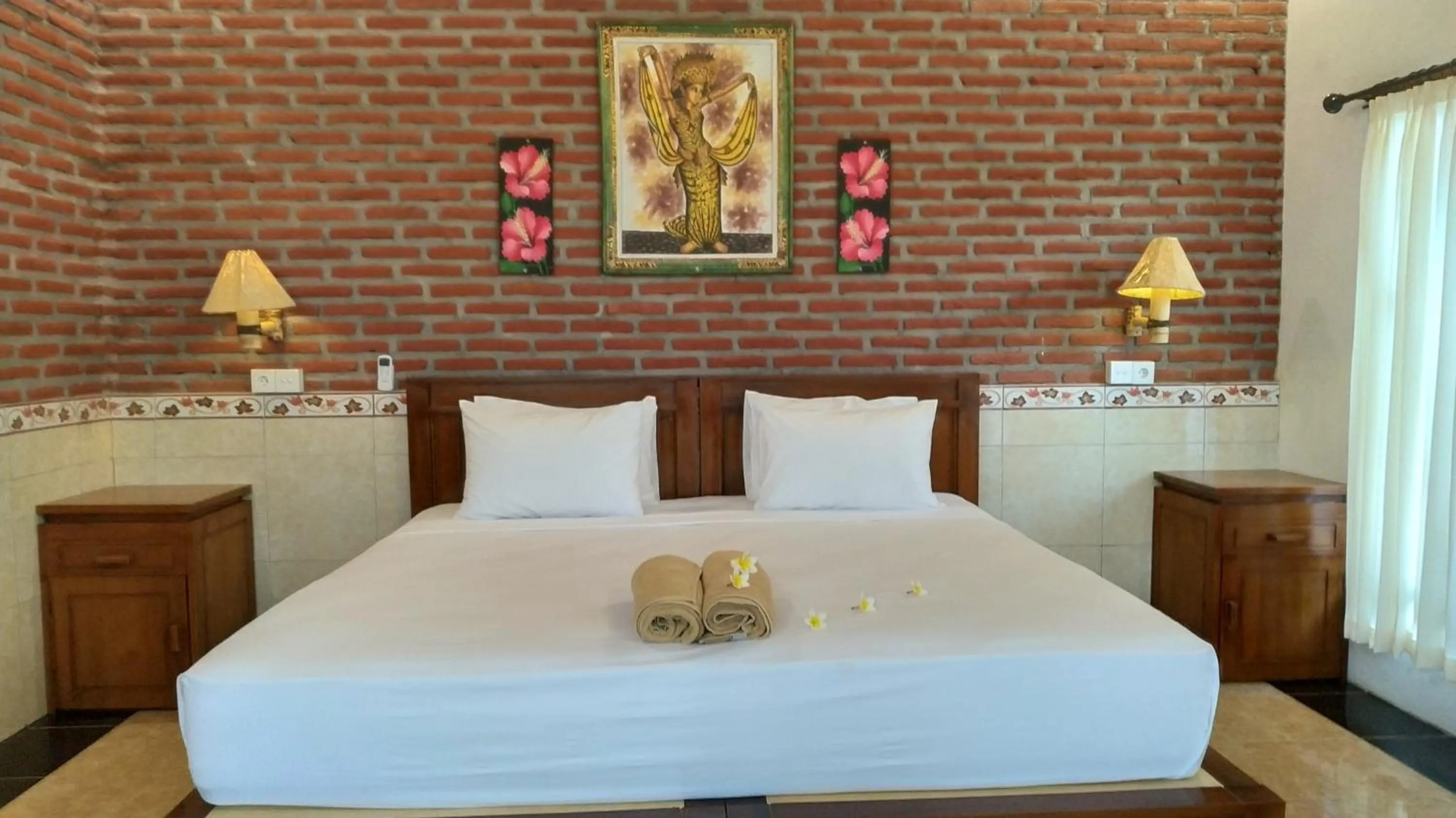 Bed in Eliska Sari Bungalows Sumberkima