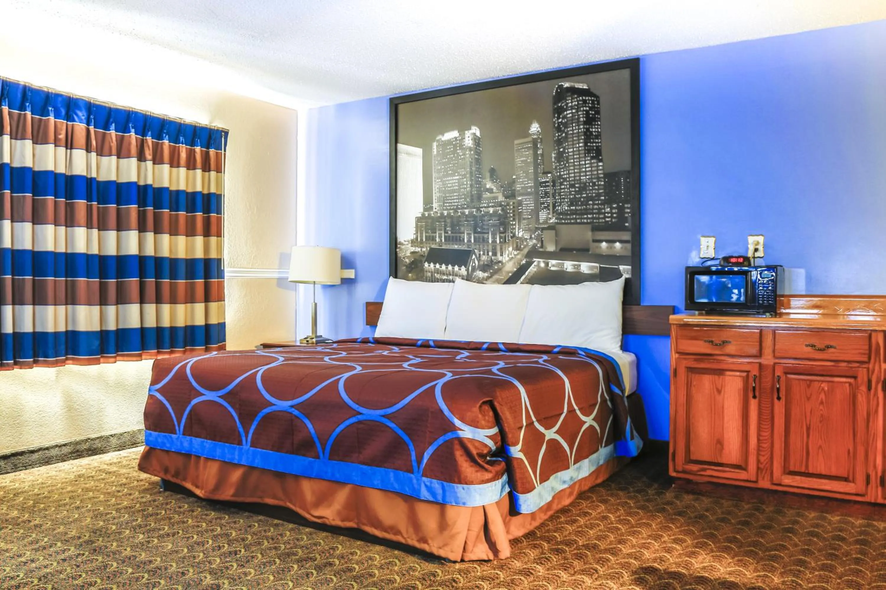 Bedroom in Super 8 by Wyndham Charlotte University