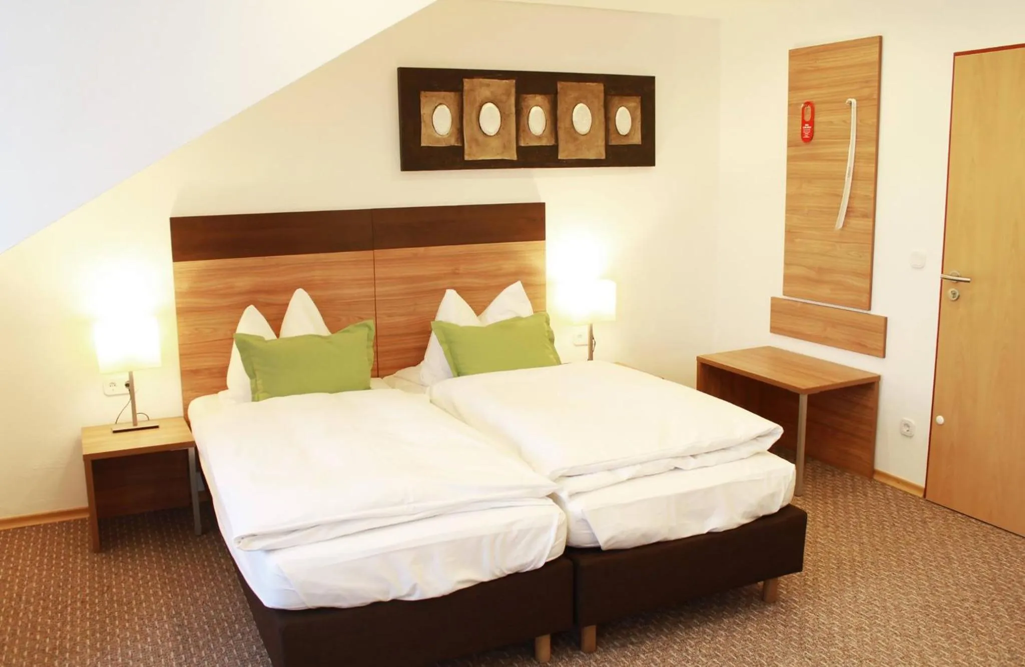 Bed in Hotel Hecht Garni