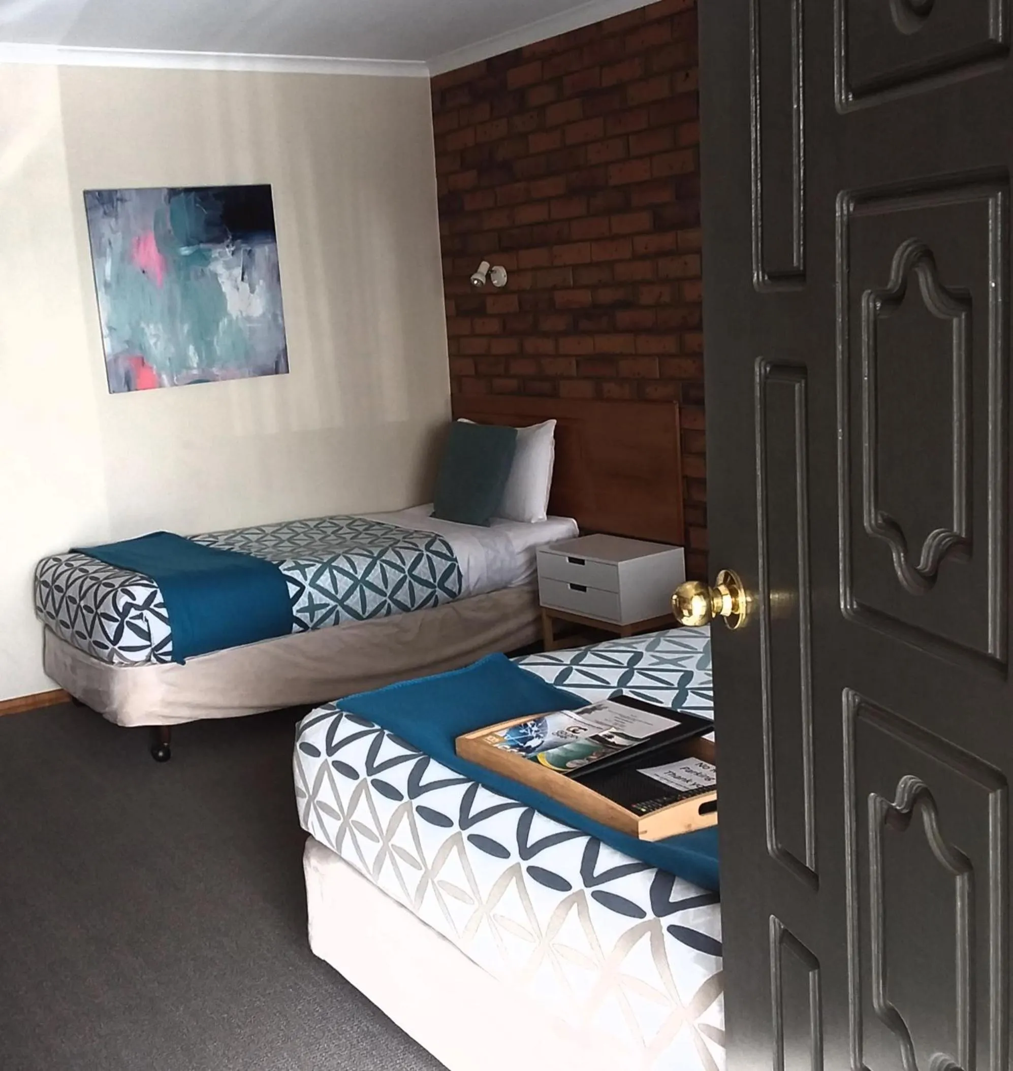 Bed in Golden Palms Motel