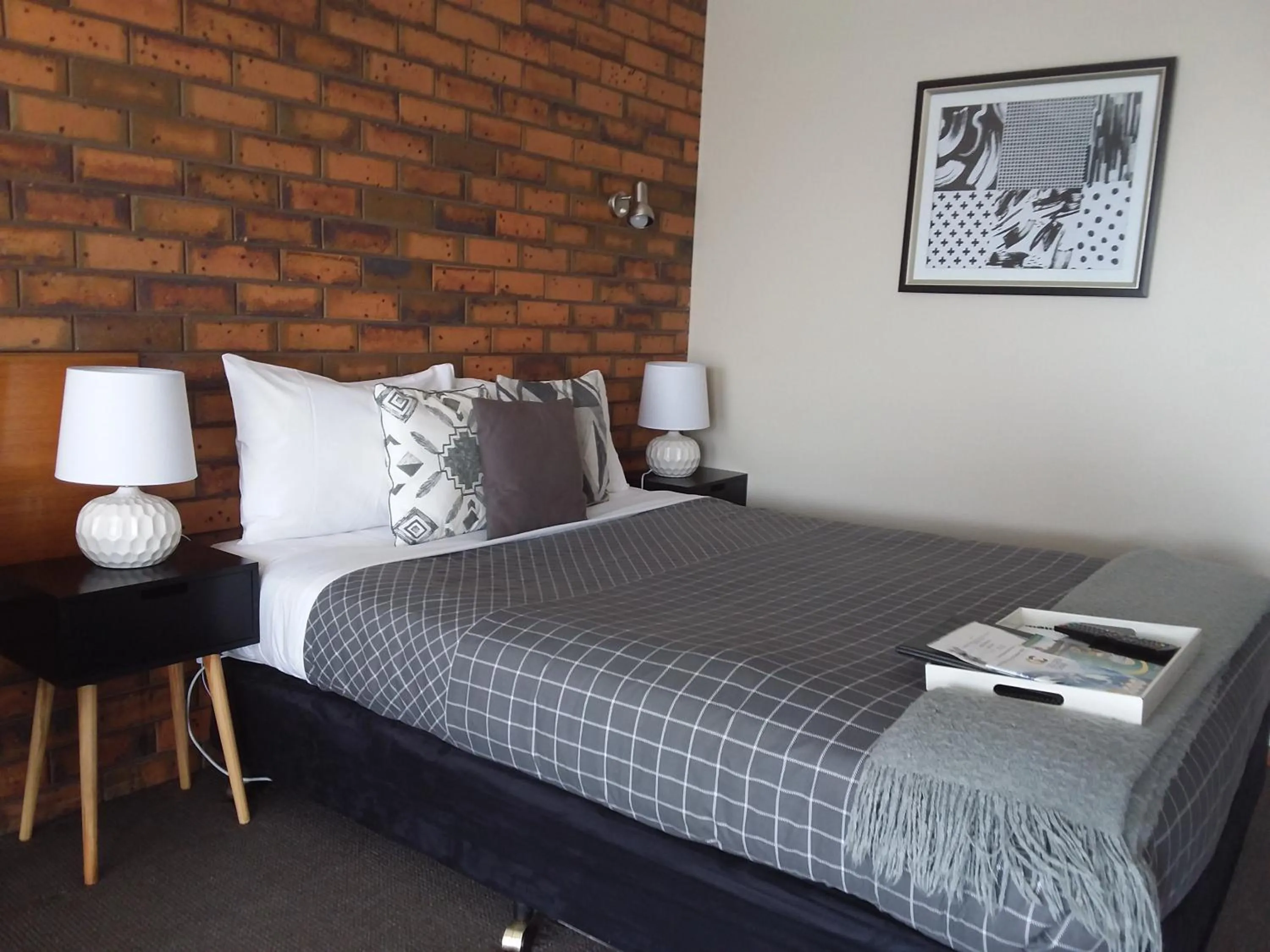 Bed in Golden Palms Motel