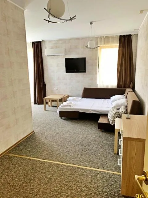 Living room, Bed in Golden Rainbow Beach Hotel