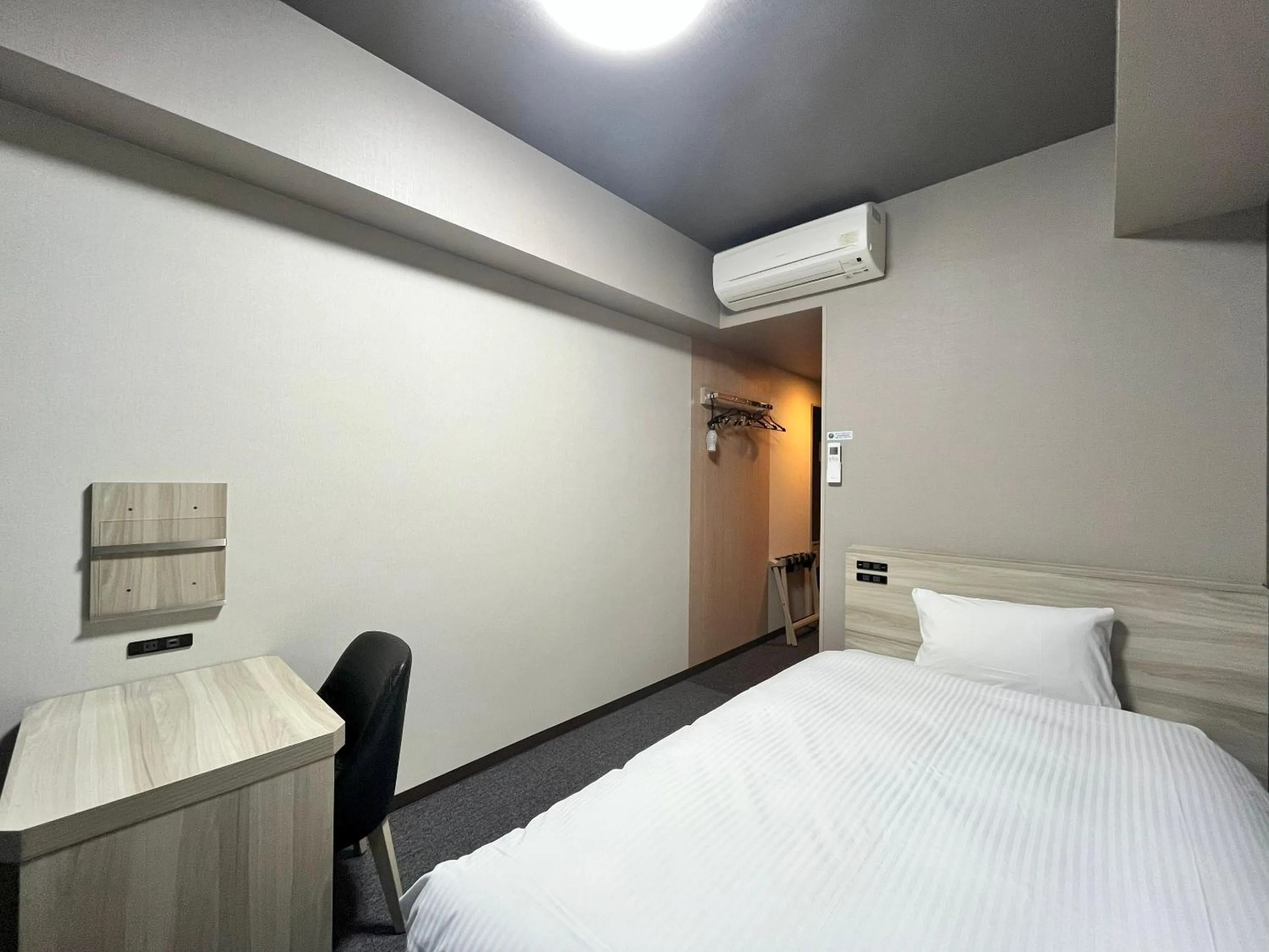 Photo of the whole room, Bed in Hotel Route-Inn Nagaoka Ekimae